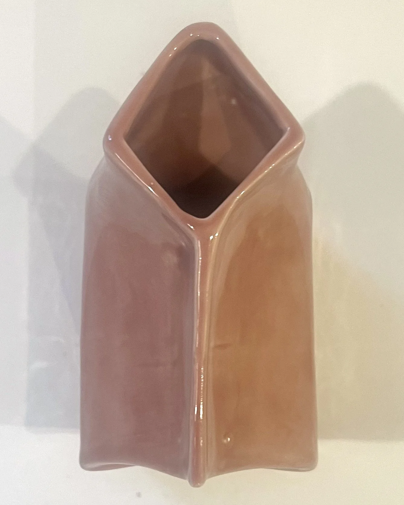 Top view of blush porcelain milk carton sculpture showing the square opening and glazed porcelain interior.
