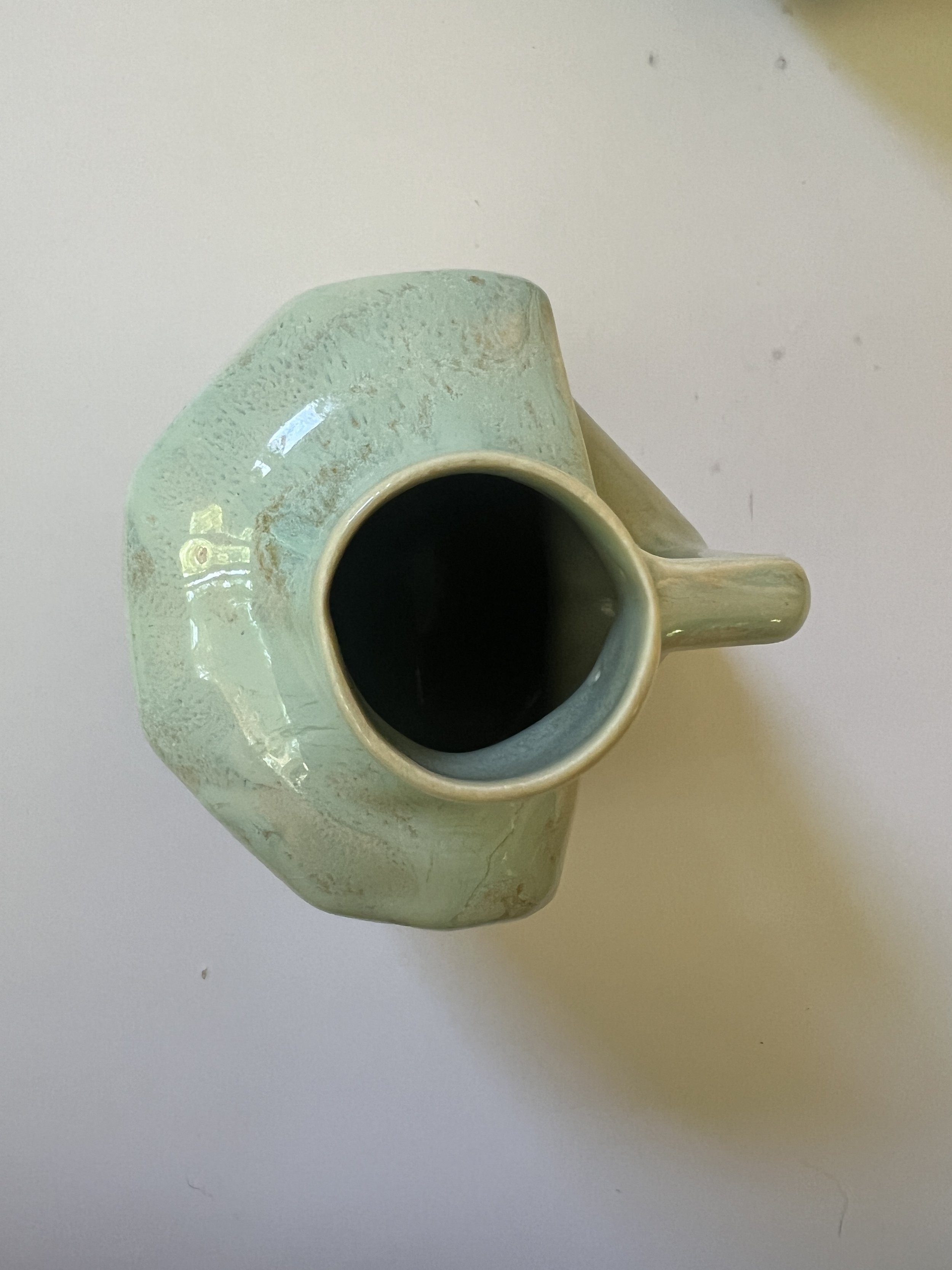 Top view of handmade ceramic vessel with narrow opening