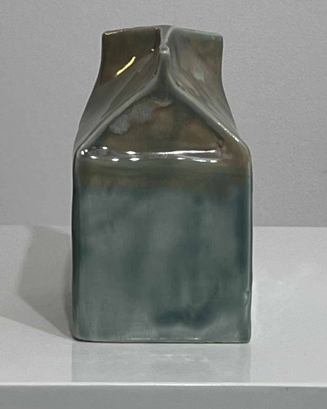 Opposite side of handmade ceramic milk carton showing layered Fog and Mystic Tide glaze variation.