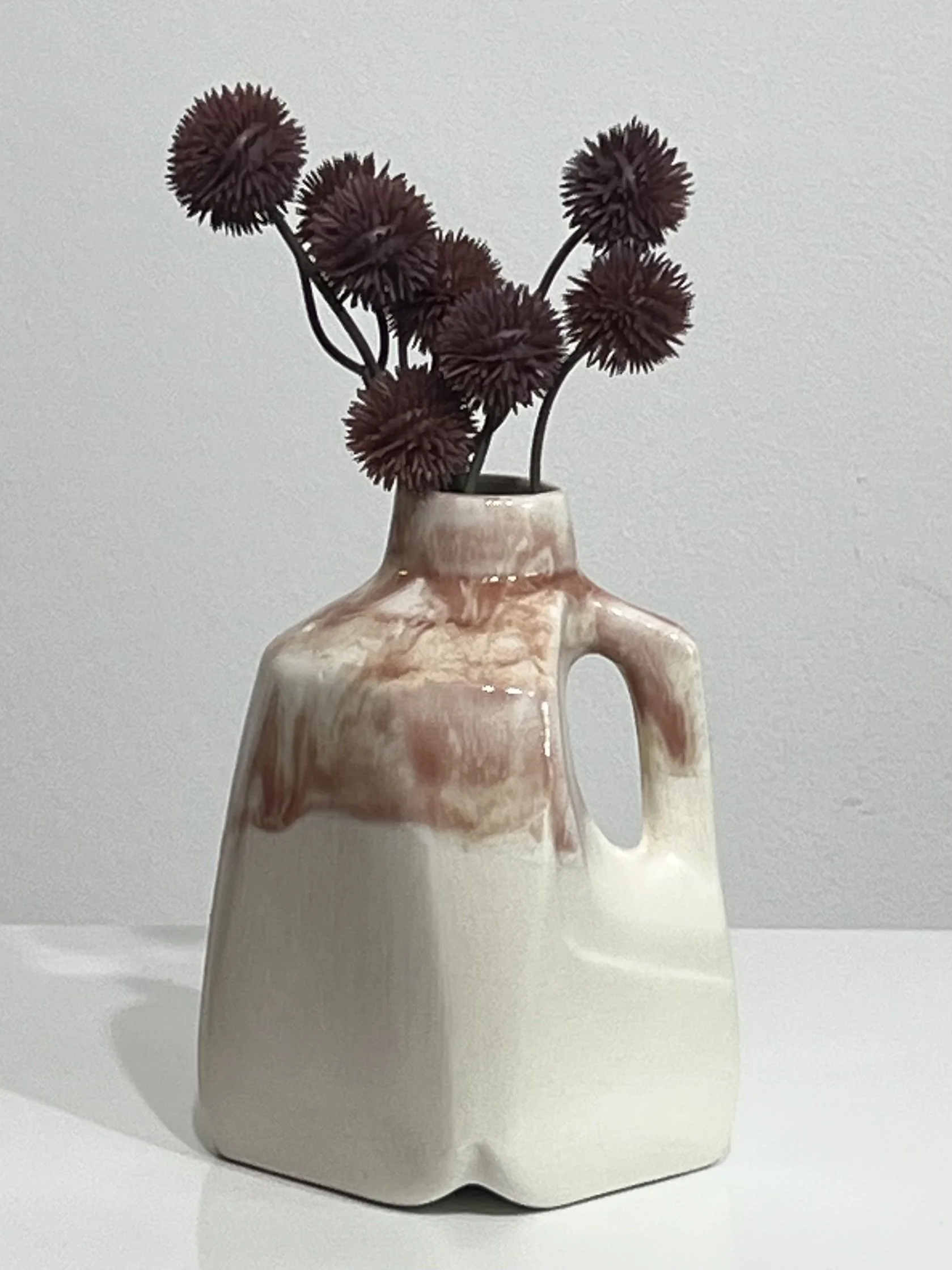 Porcelain jug with layered Weeping Plum glaze and dark red dried flowers