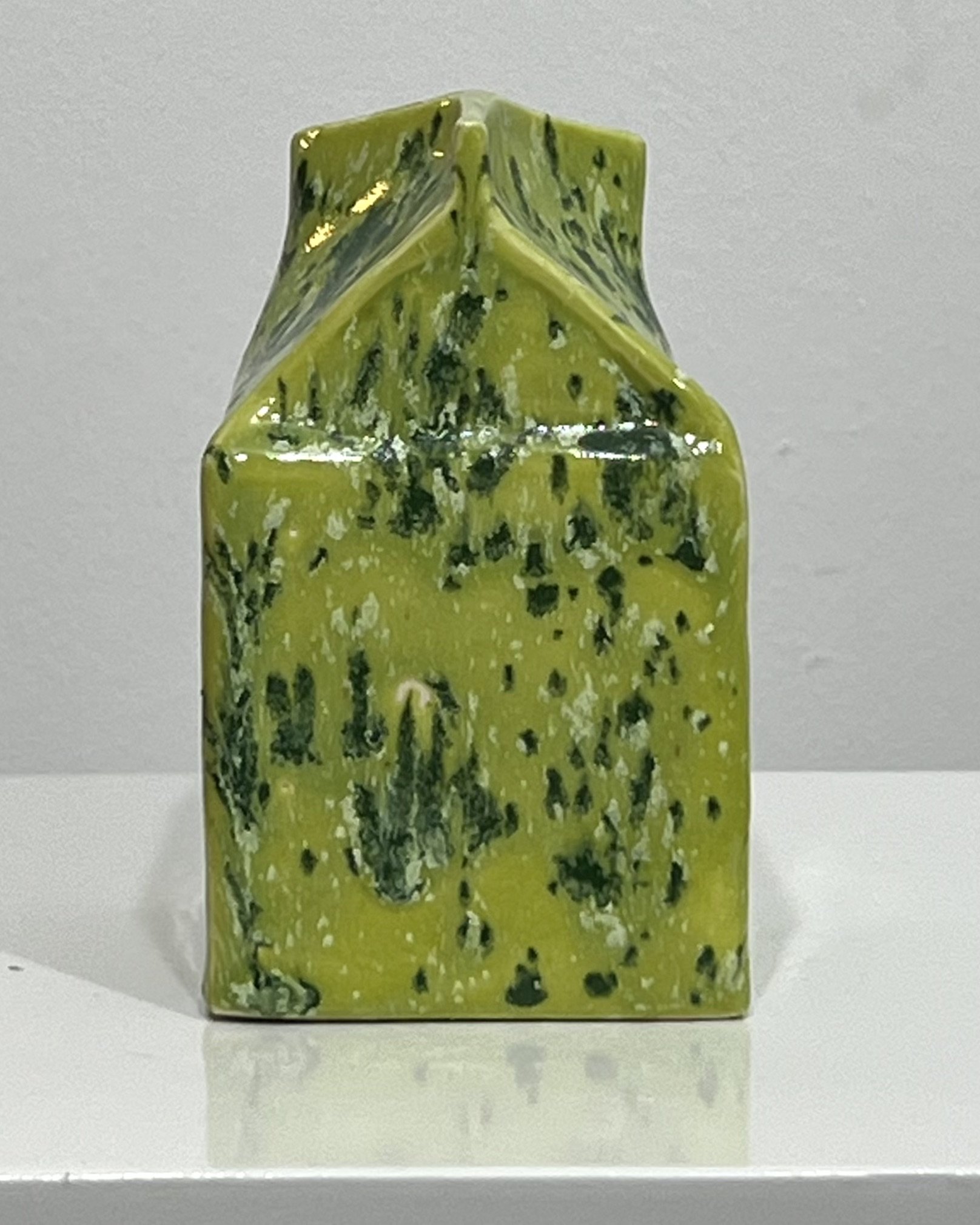 Rear view of contemporary ceramic milk carton vessel finished in Lime Shower chartreuse and green glaze.