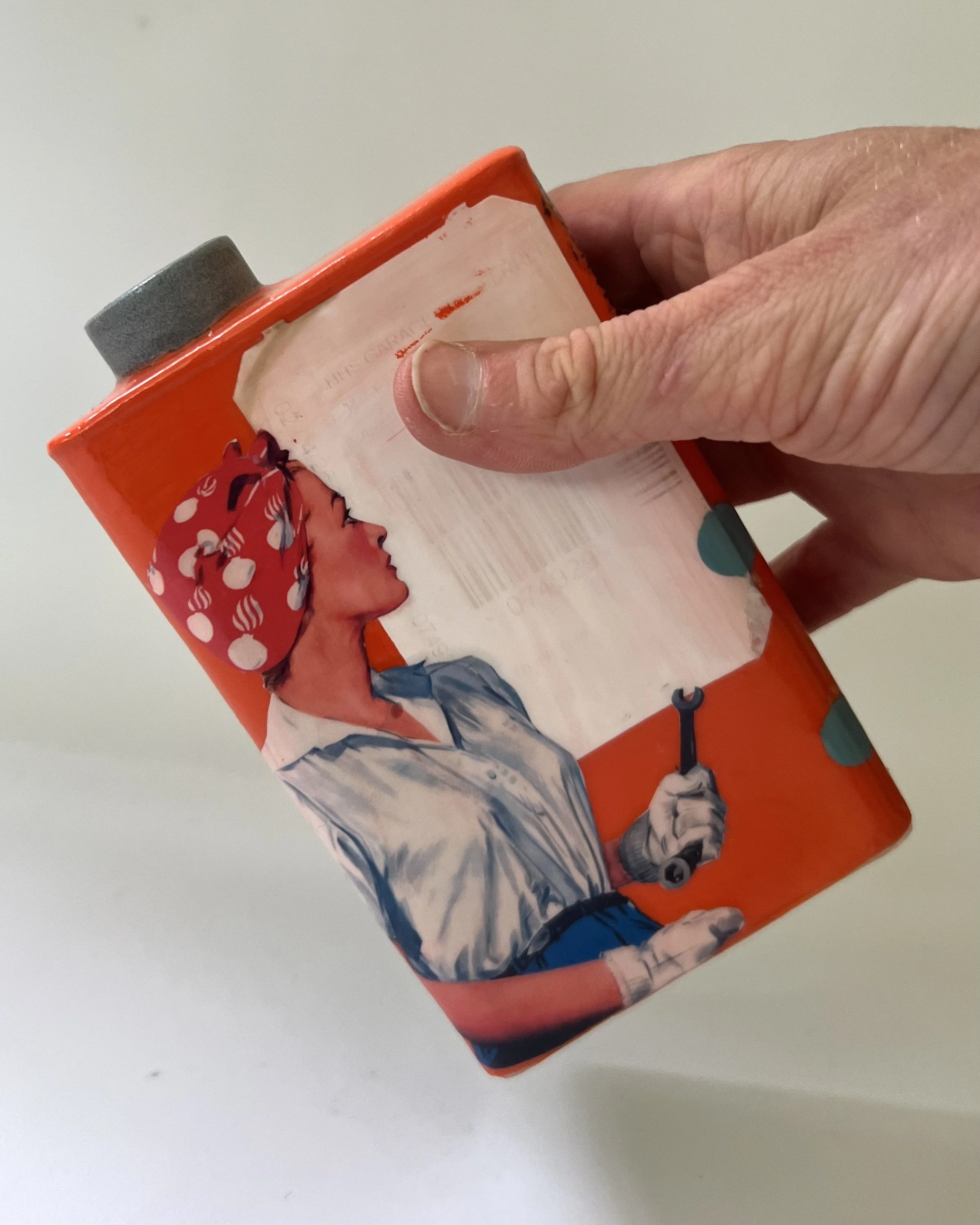 She Kept Her Feathers Sharp porcelain Art Carton shown in hand for scale, handmade by Asheville artist Alissa Van Atta.