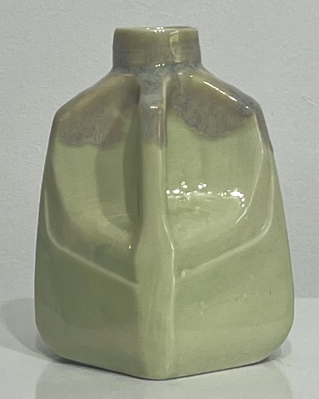 Right-side view of Saguaro and Opal Lustre glazed porcelain milk jug showing its distinctive handle.