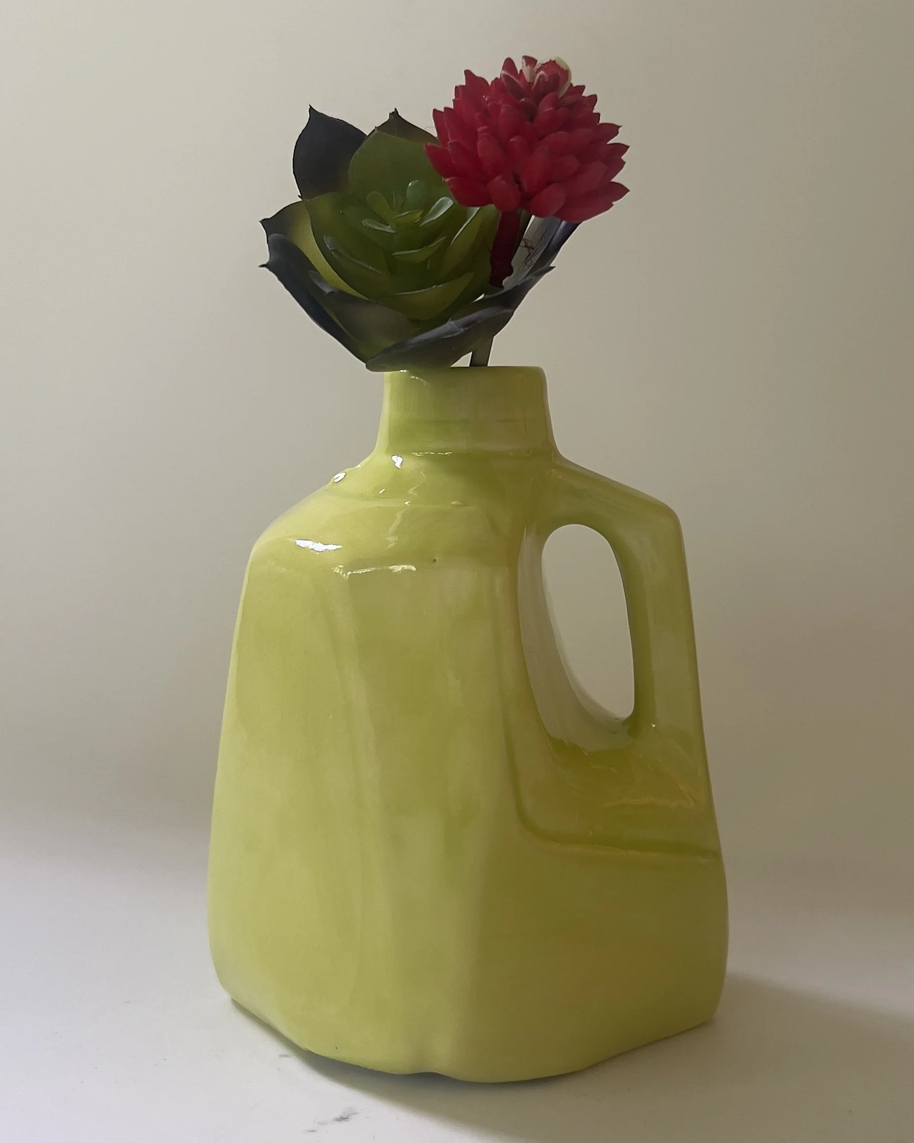 Handmade Pear ceramic jug displayed with flowers to show scale and styling possibilities.