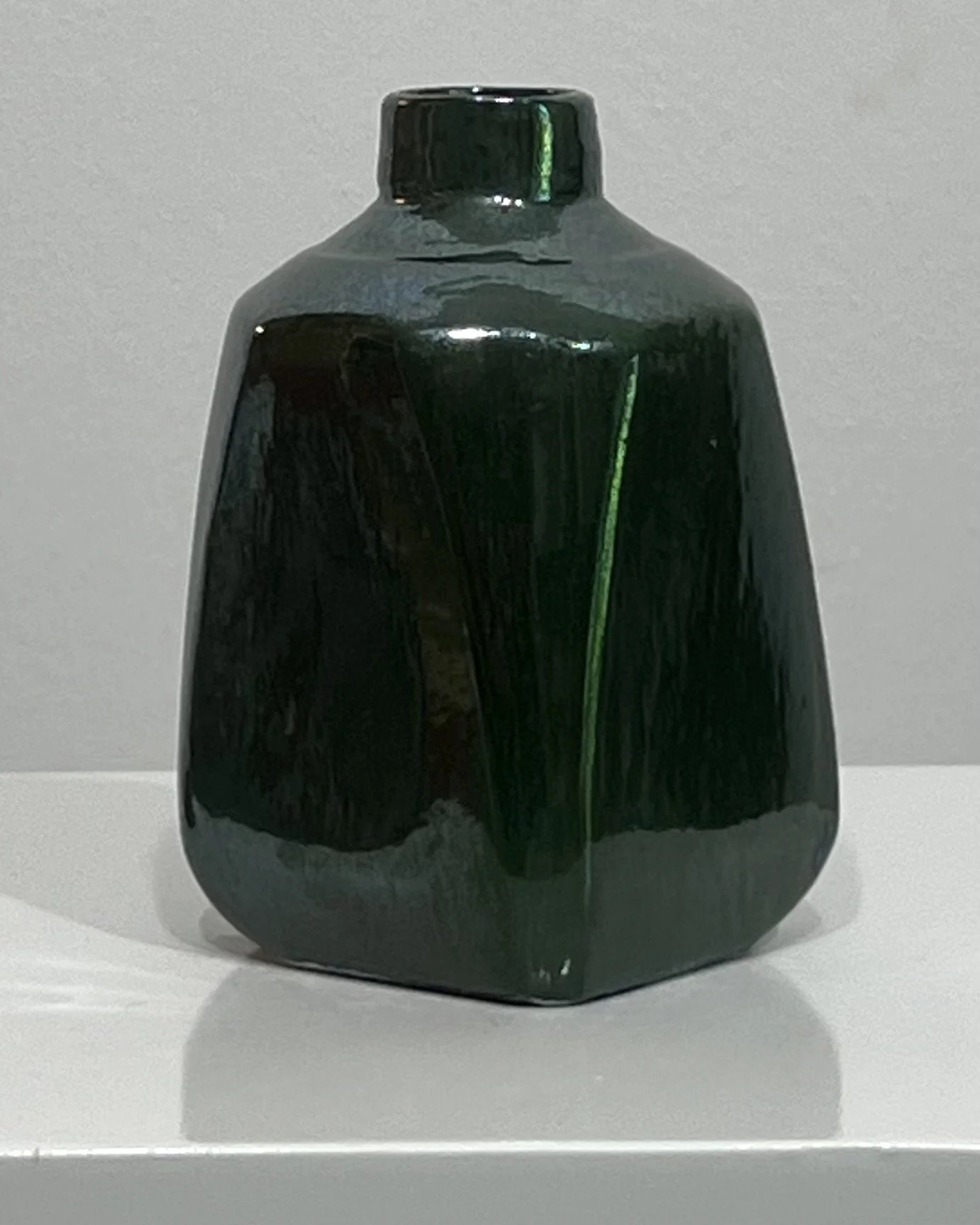 Back view of handmade porcelain milk jug 26.48 finished in Junebug glaze.
