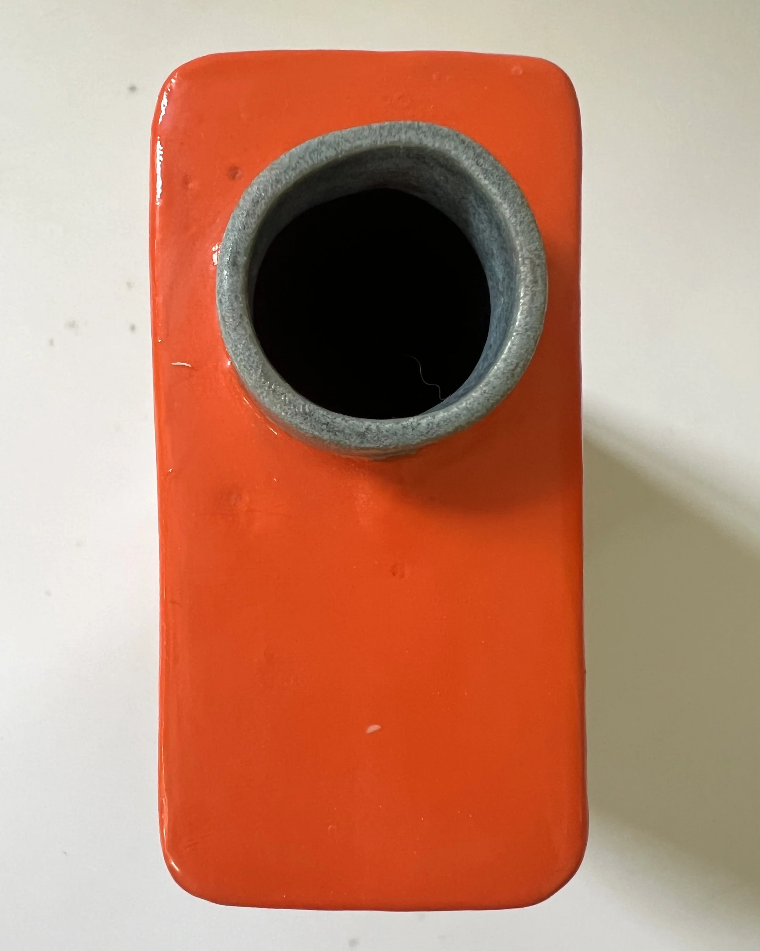 Top view of She Kept Her Feathers Sharp porcelain Art Carton showing the hand-cast ceramic opening and interior.