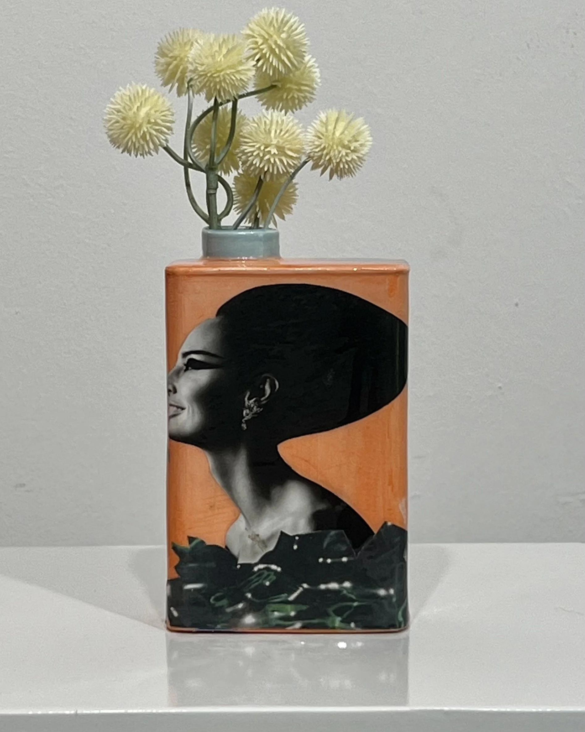 Time Bomb, original porcelain Art Carton by Alissa Van Atta displayed with dried flowers, featuring collage, acrylic, and resin.