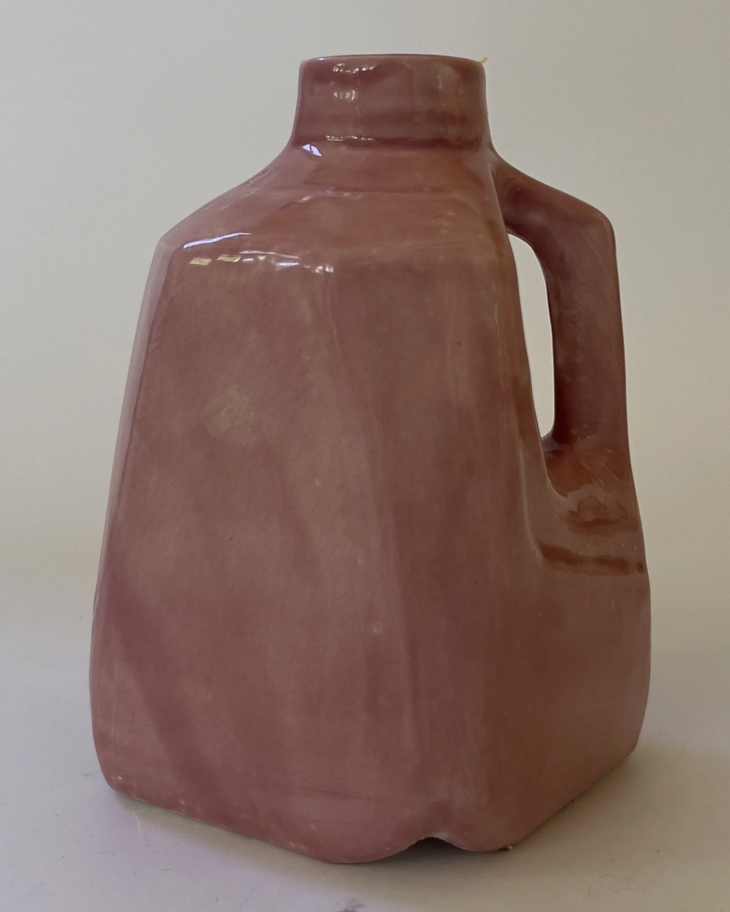 Handbuilt ceramic milk jug sculpture in glossy Weeping Plum glaze