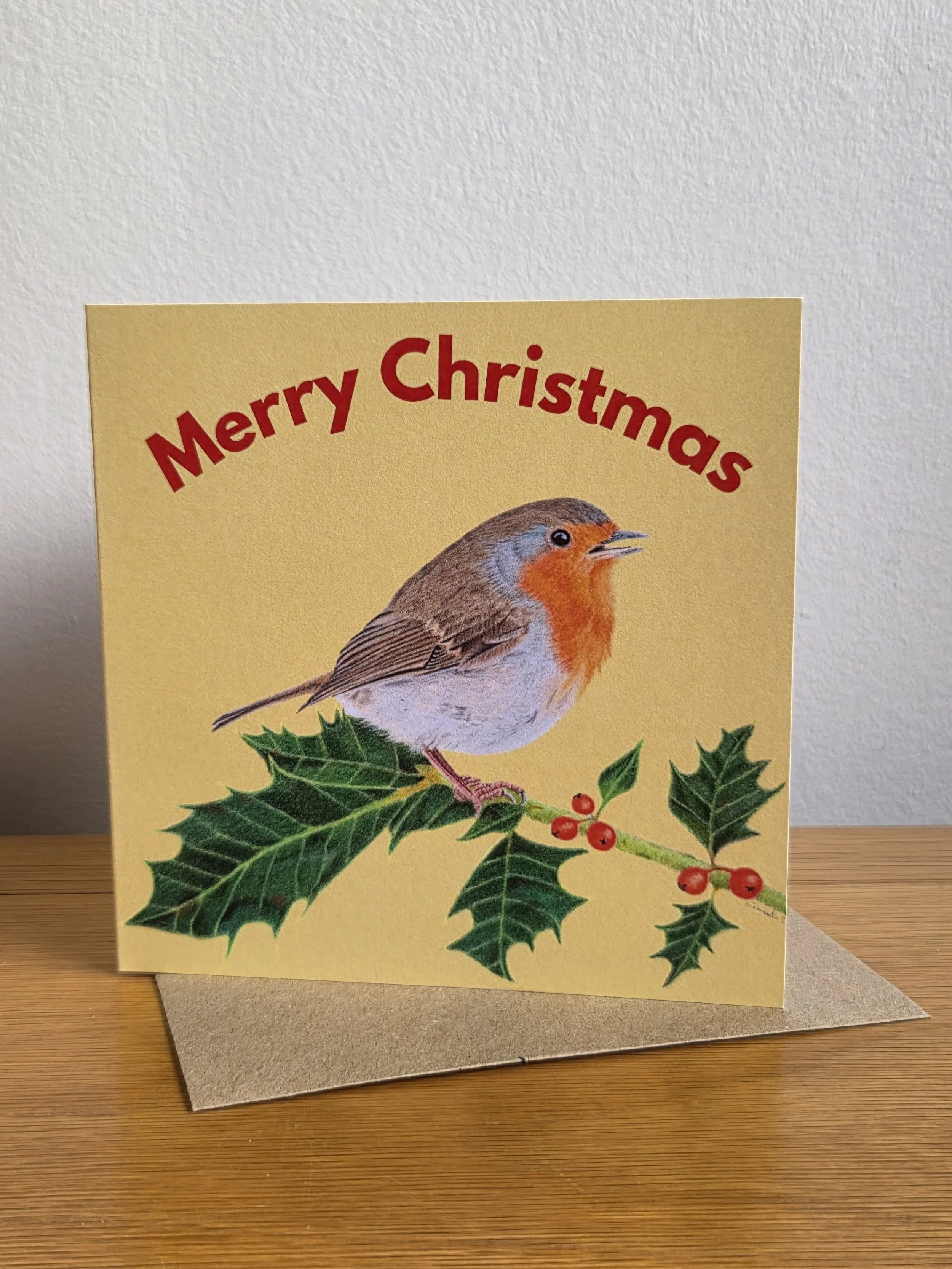Robin on holly 'Merry Christmas' card (blank inside)