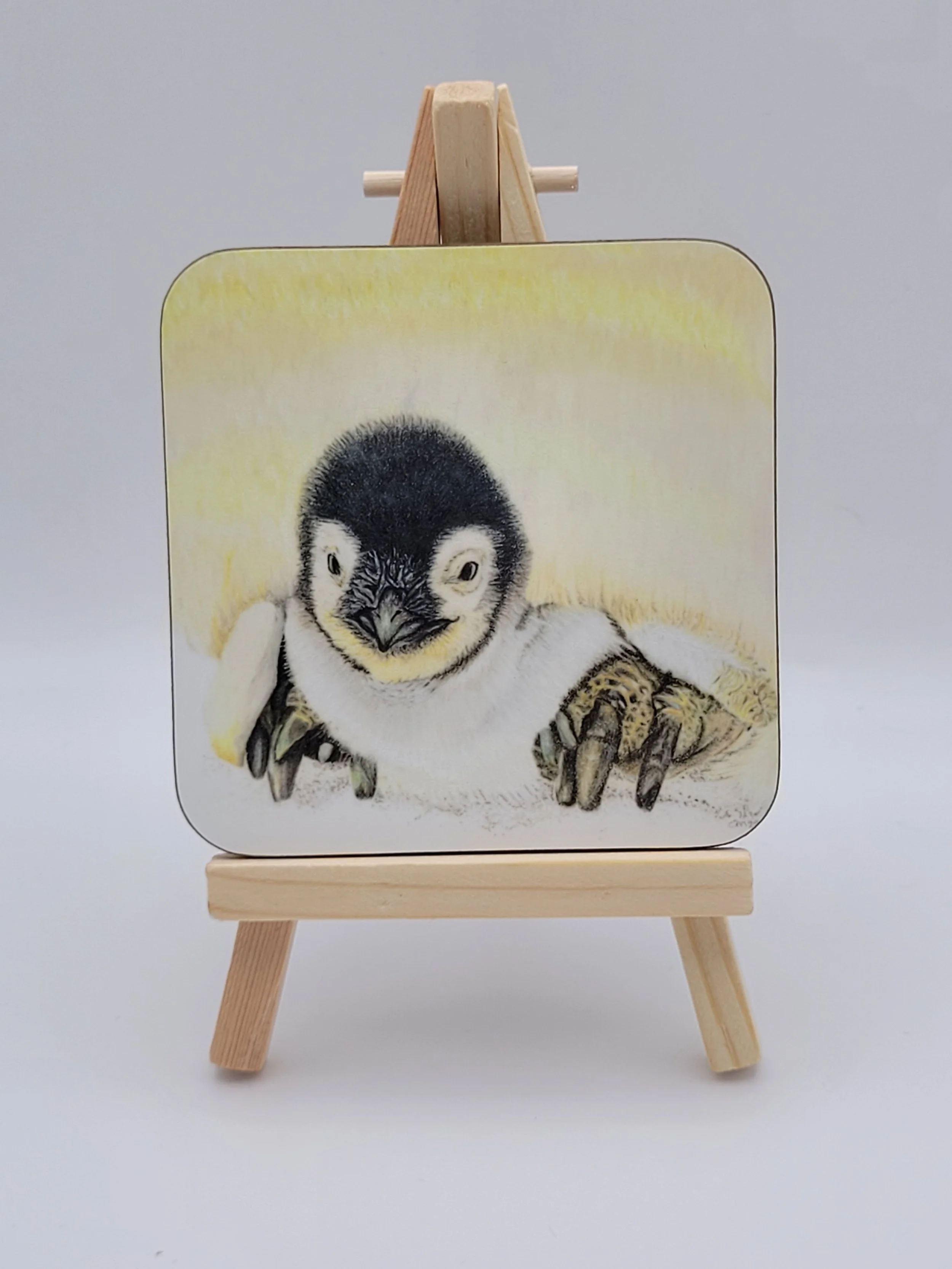 Individual glossy penguin chick coaster.
