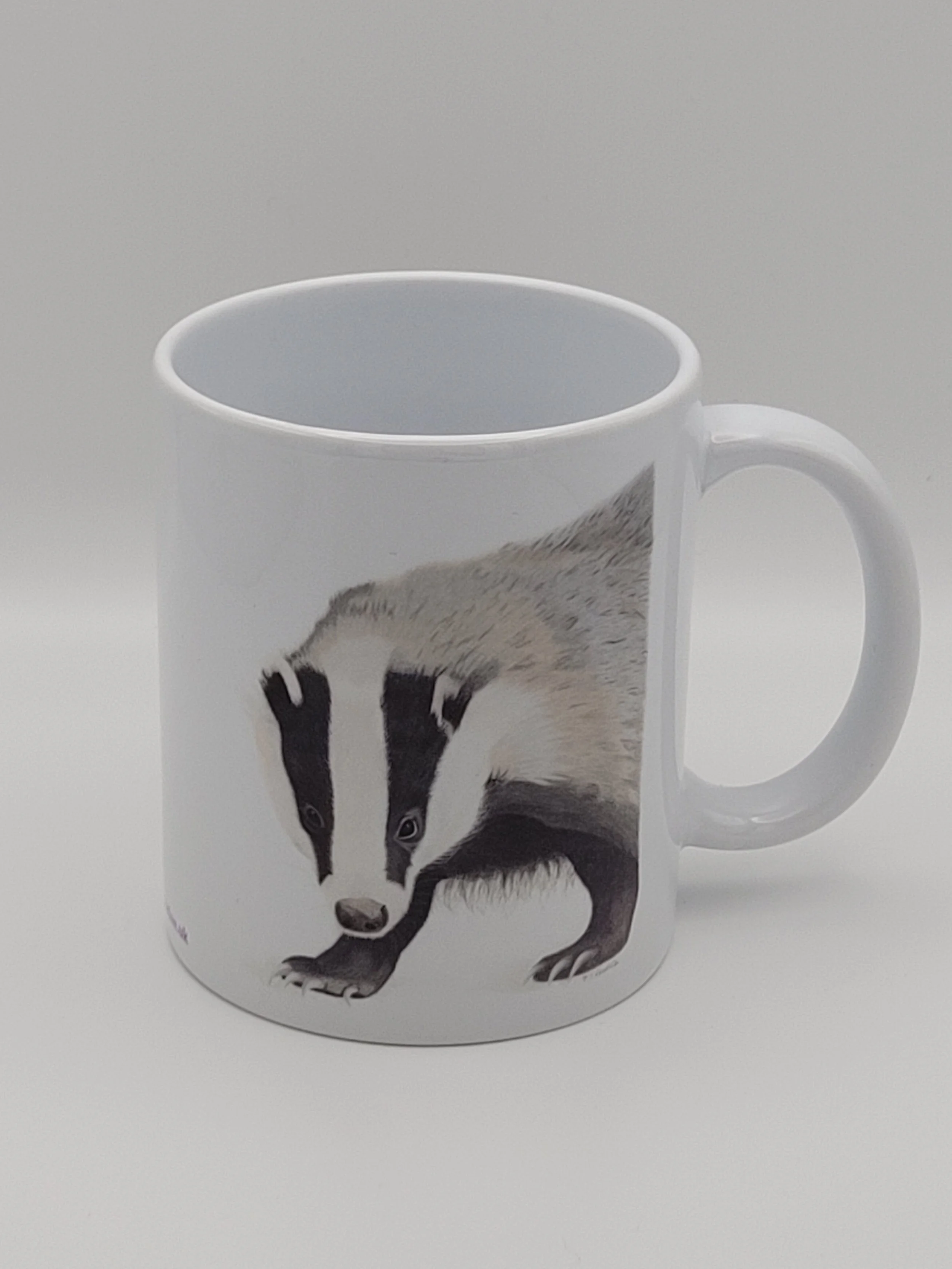 A badger white ceramic 11oz mug.