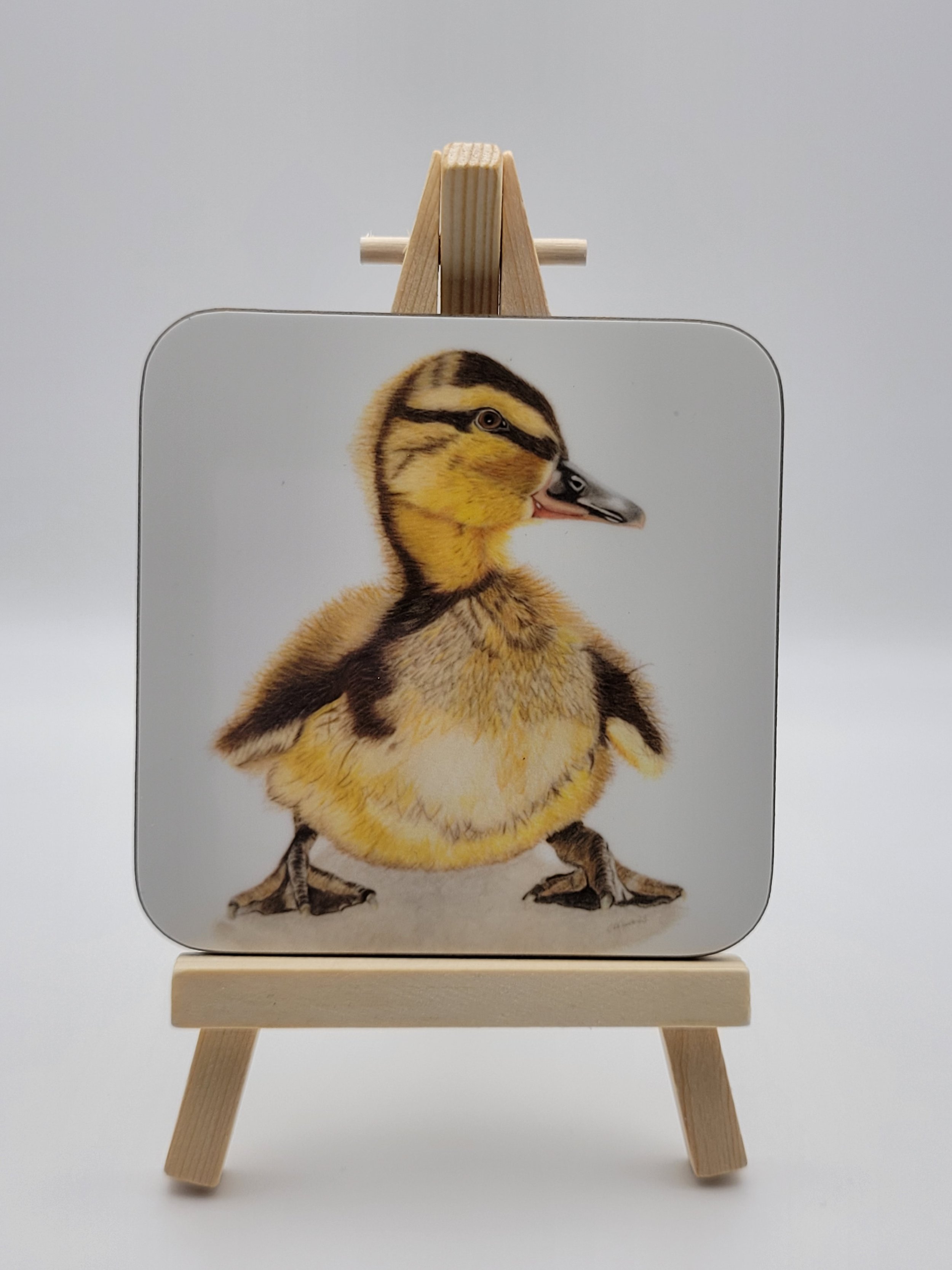 Individual glossy duckling coaster (9cm square).