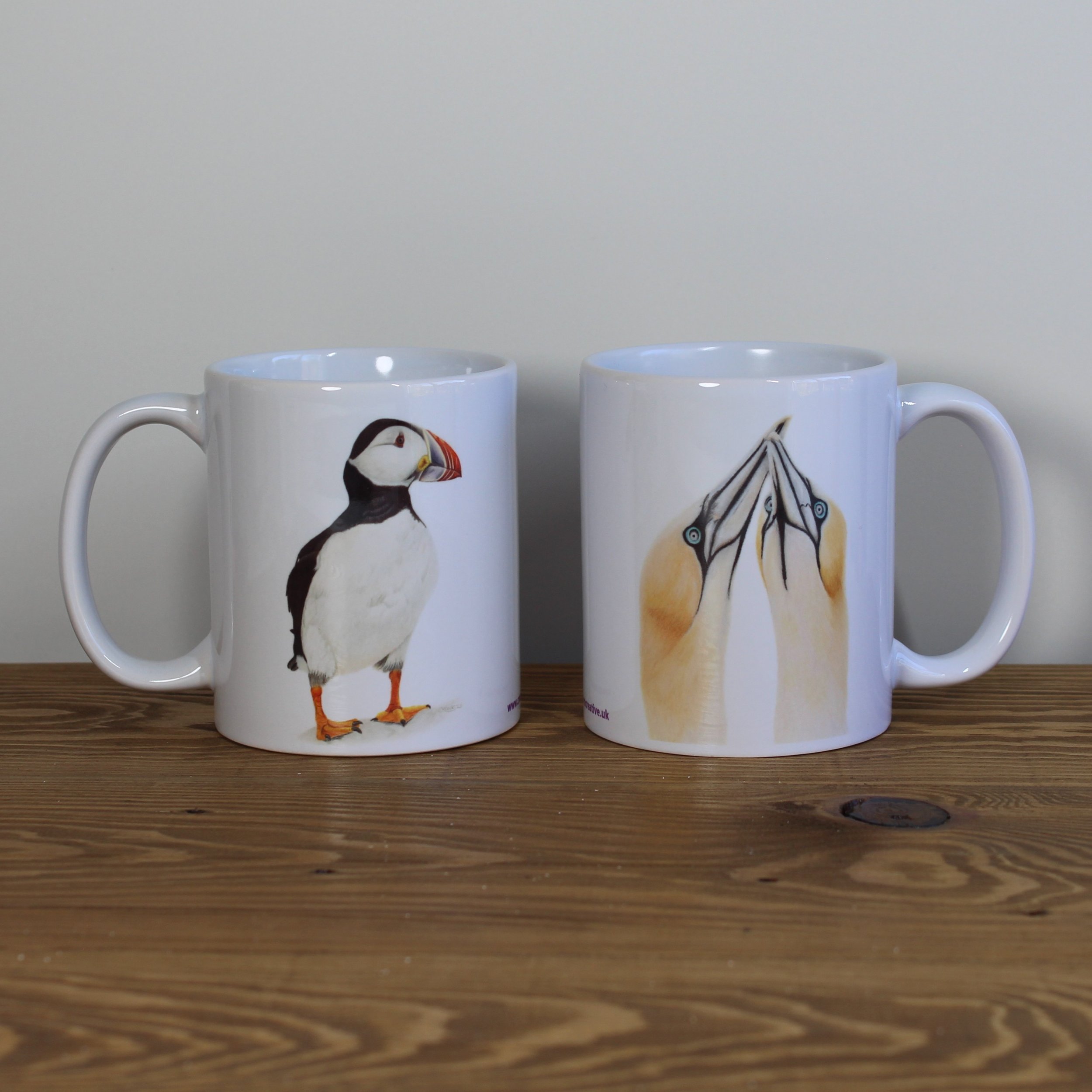 Puffin and gannets white 11oz ceramic mugs.