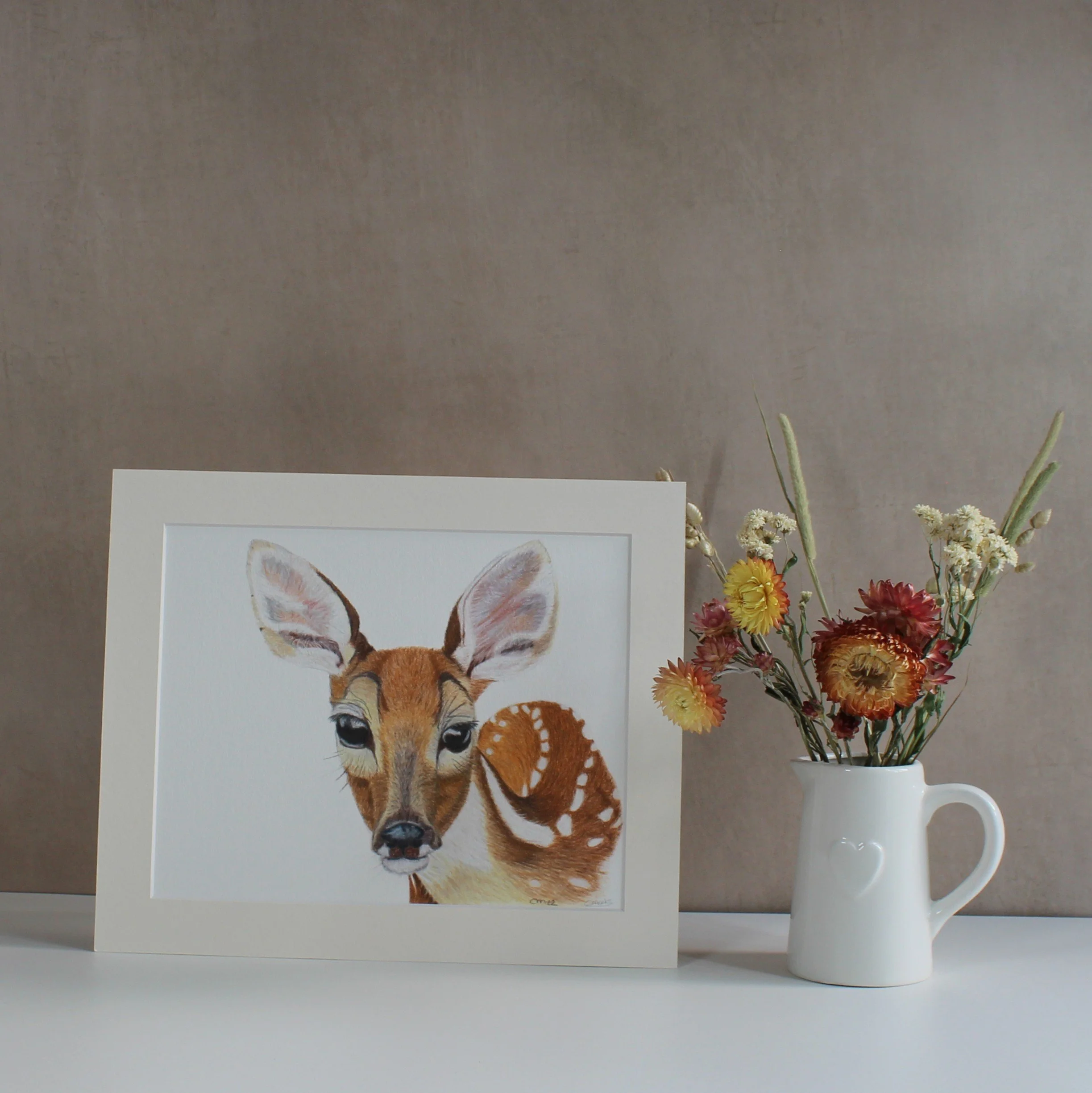 A mounted fine art print featuring a deer drawing.