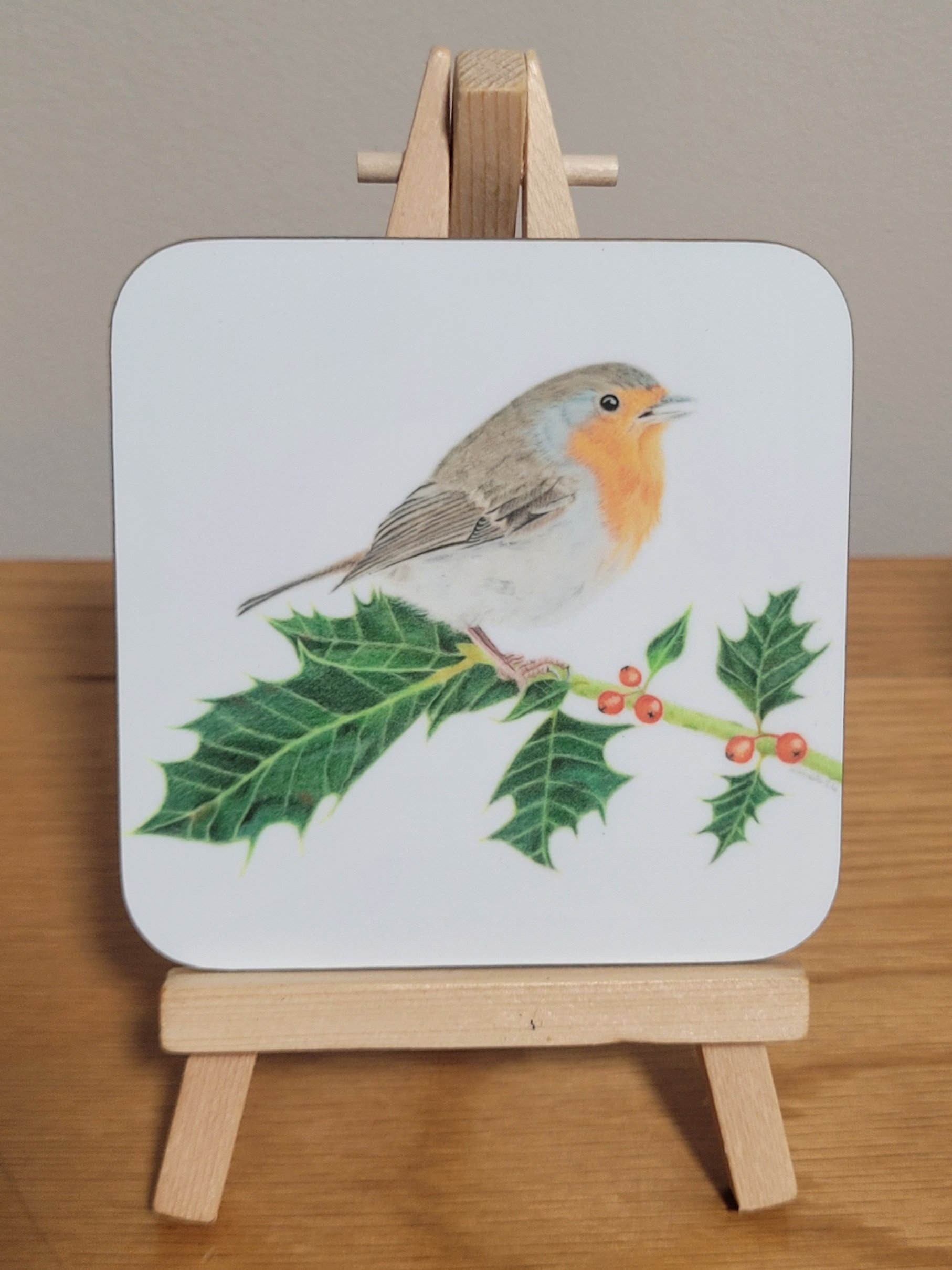Robin on holly coaster.