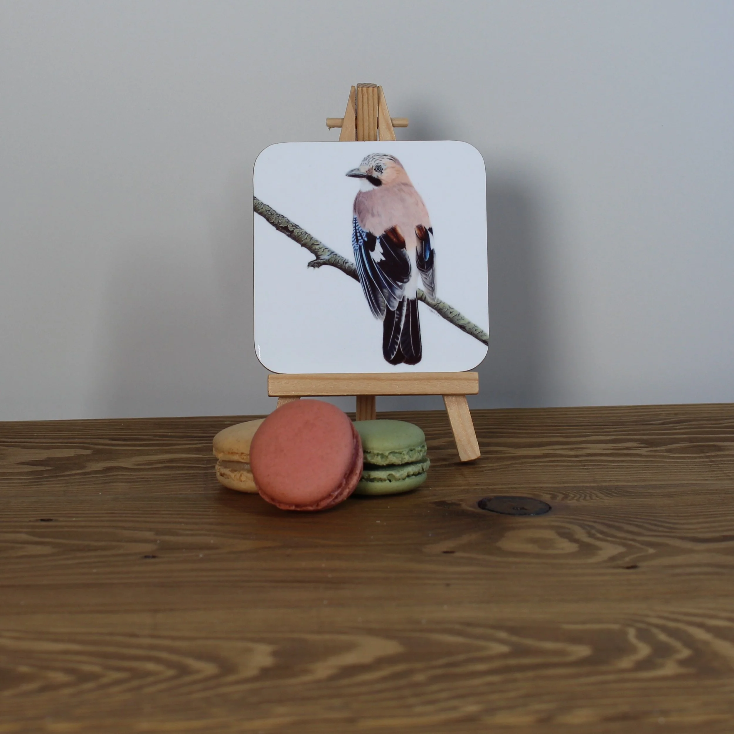 Individual glossy jay coaster.