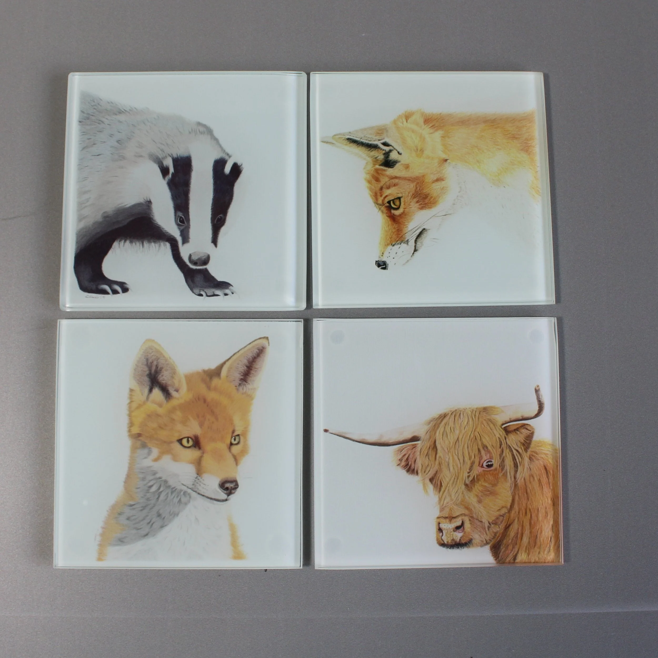 Gazing fox, badger and highland cow glass coasters.