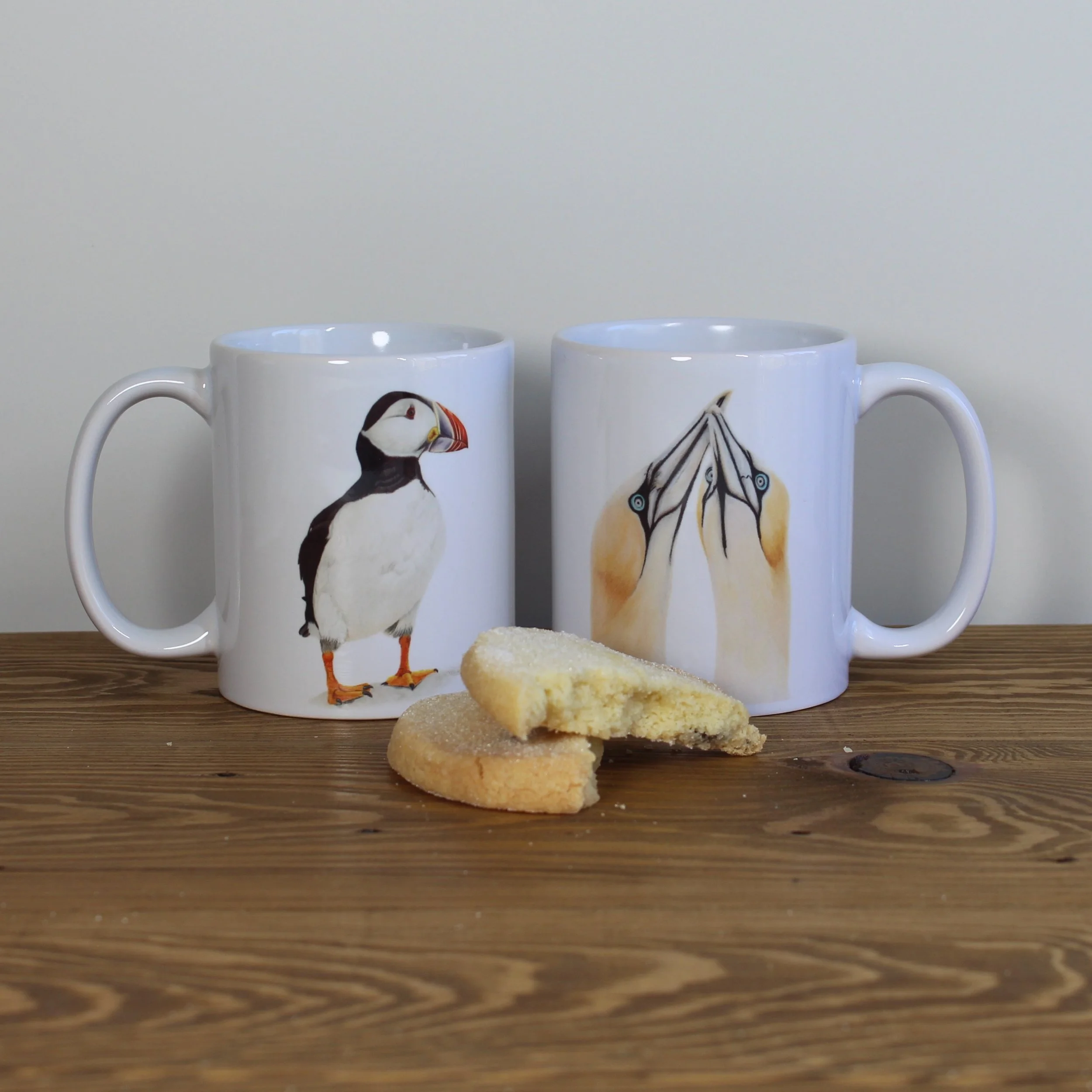 Gannets and puffin white 11oz ceramic mugs.