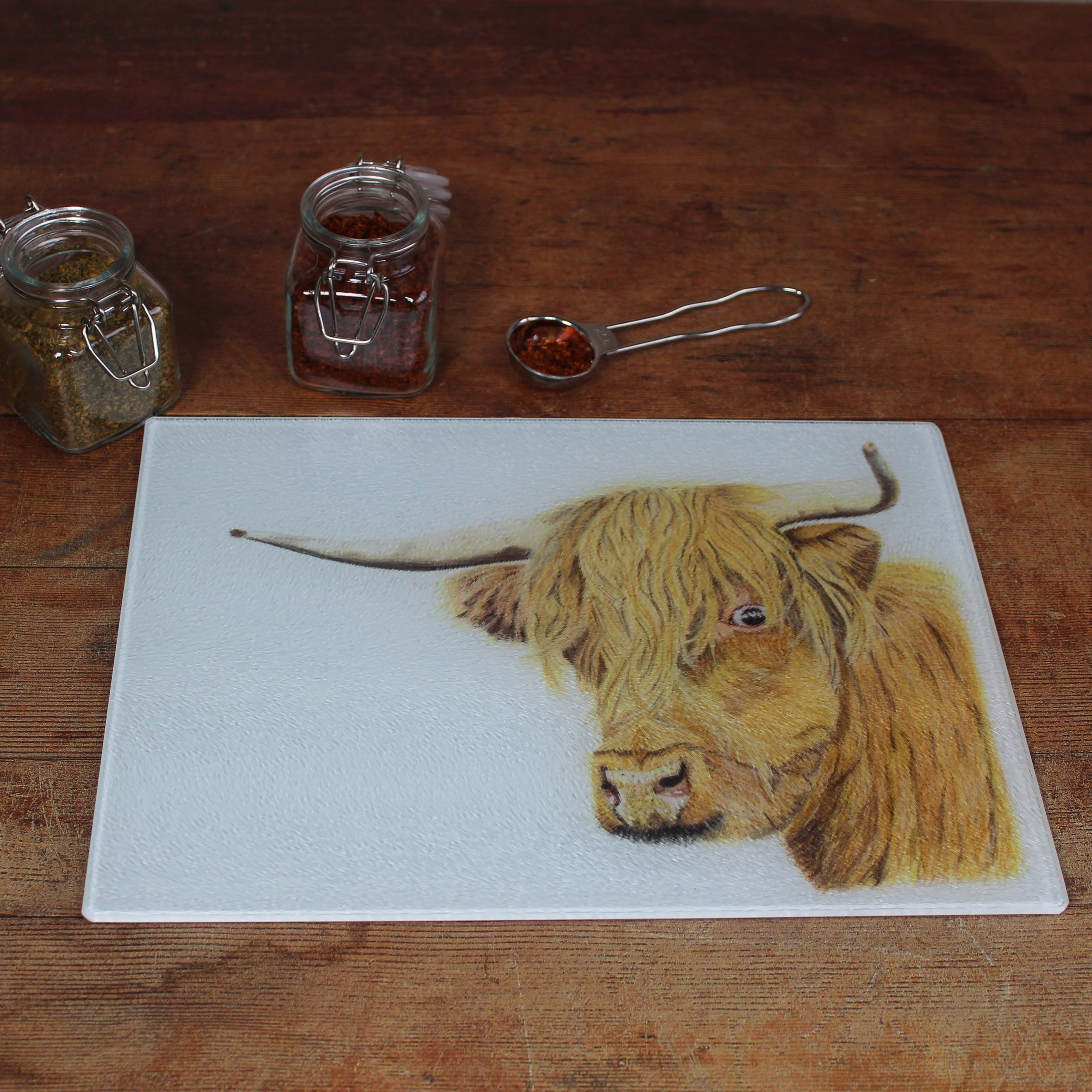 Highland cow small glass chopping board / worktop saver.