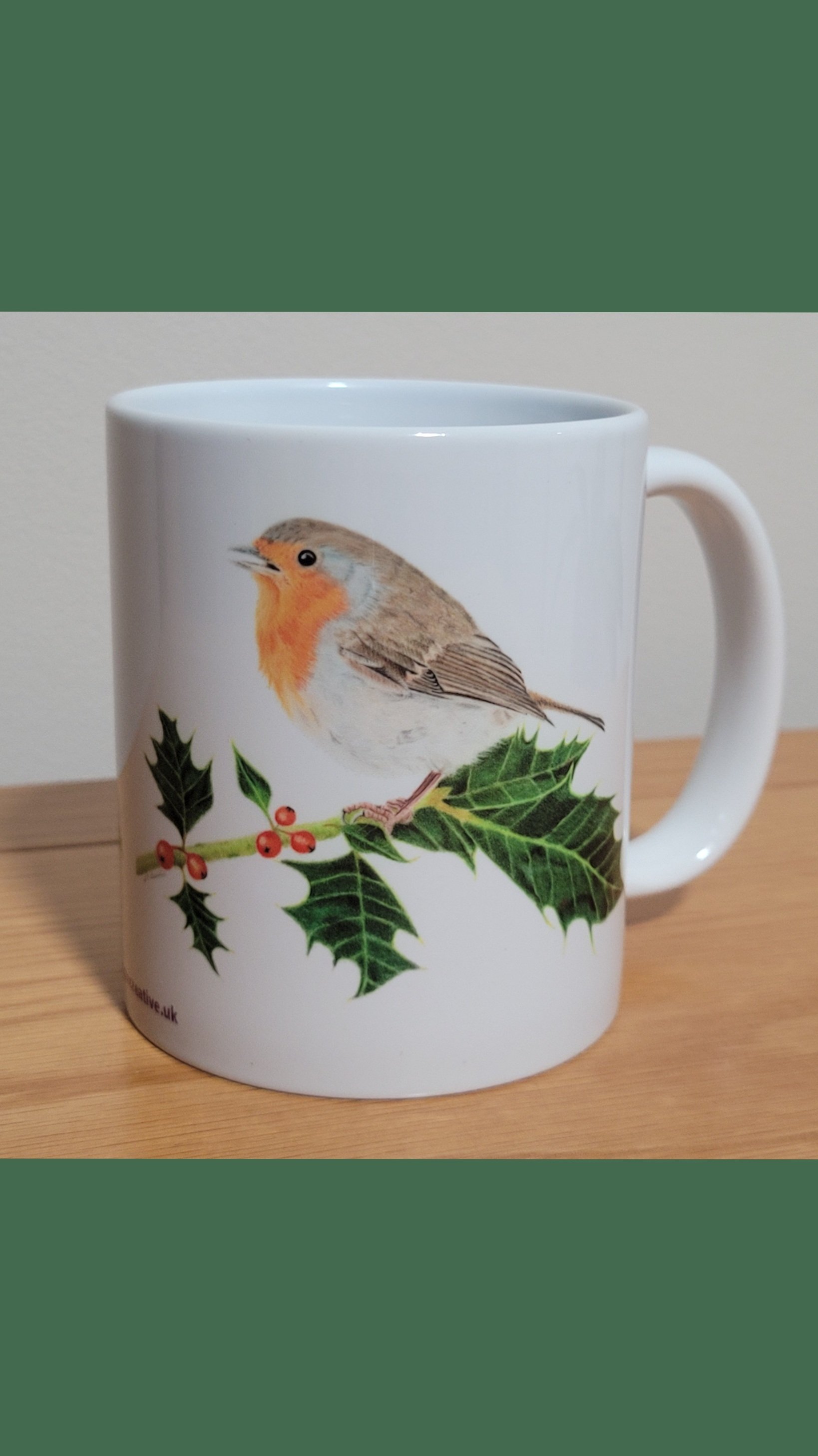 Robin on holly mug.