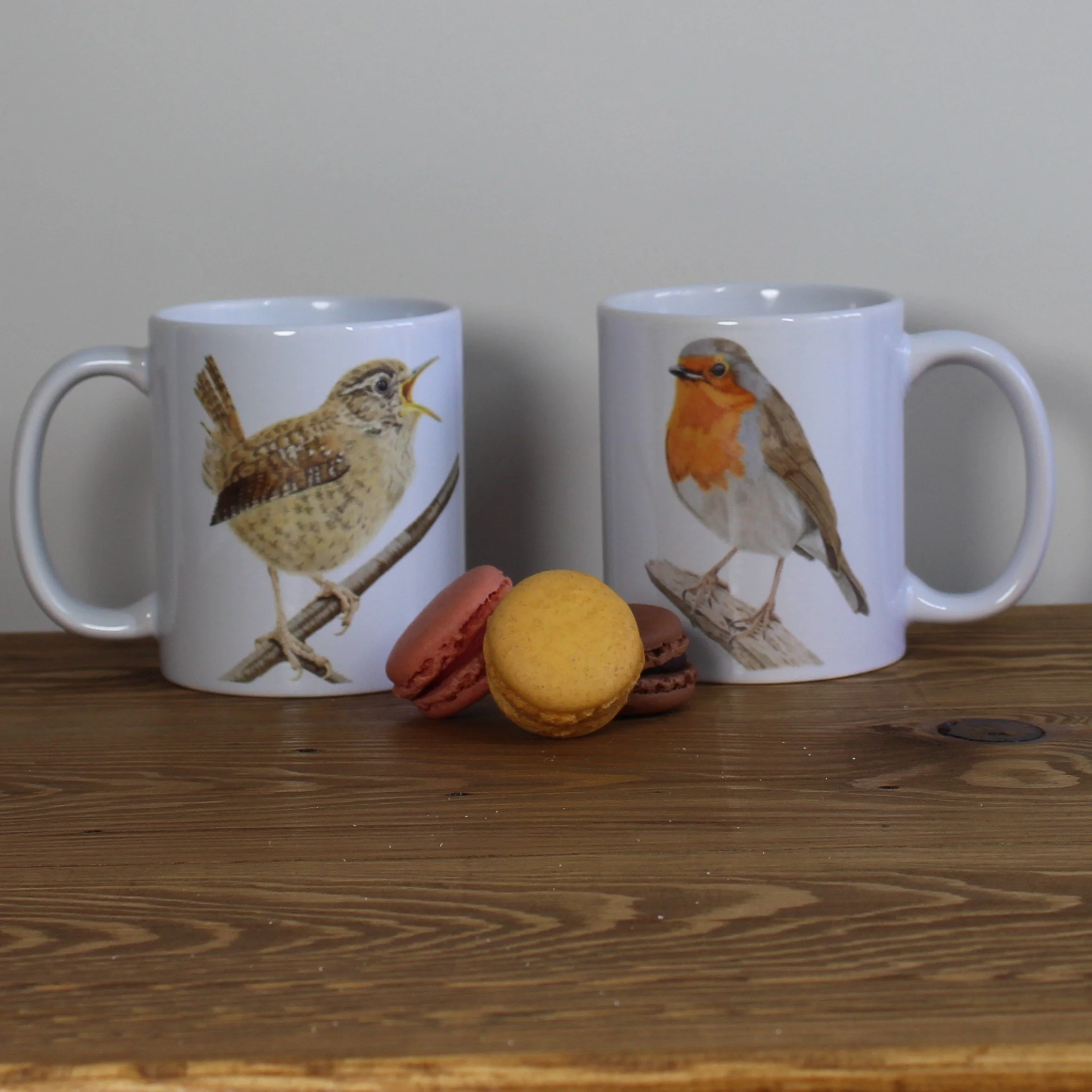 Singing wren white 11oz ceramic mug and matching robin mug.