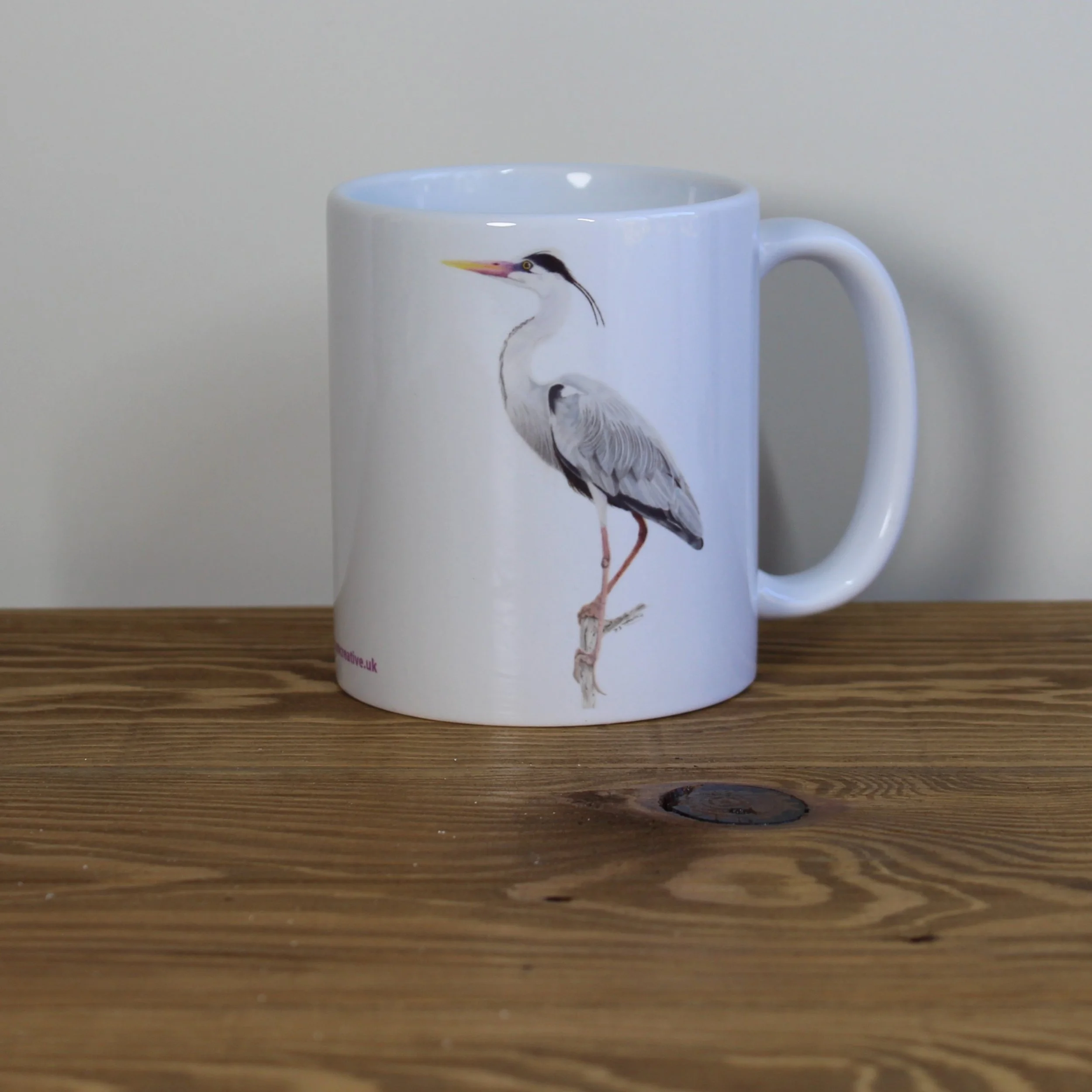 Heron white 11oz ceramic mug.