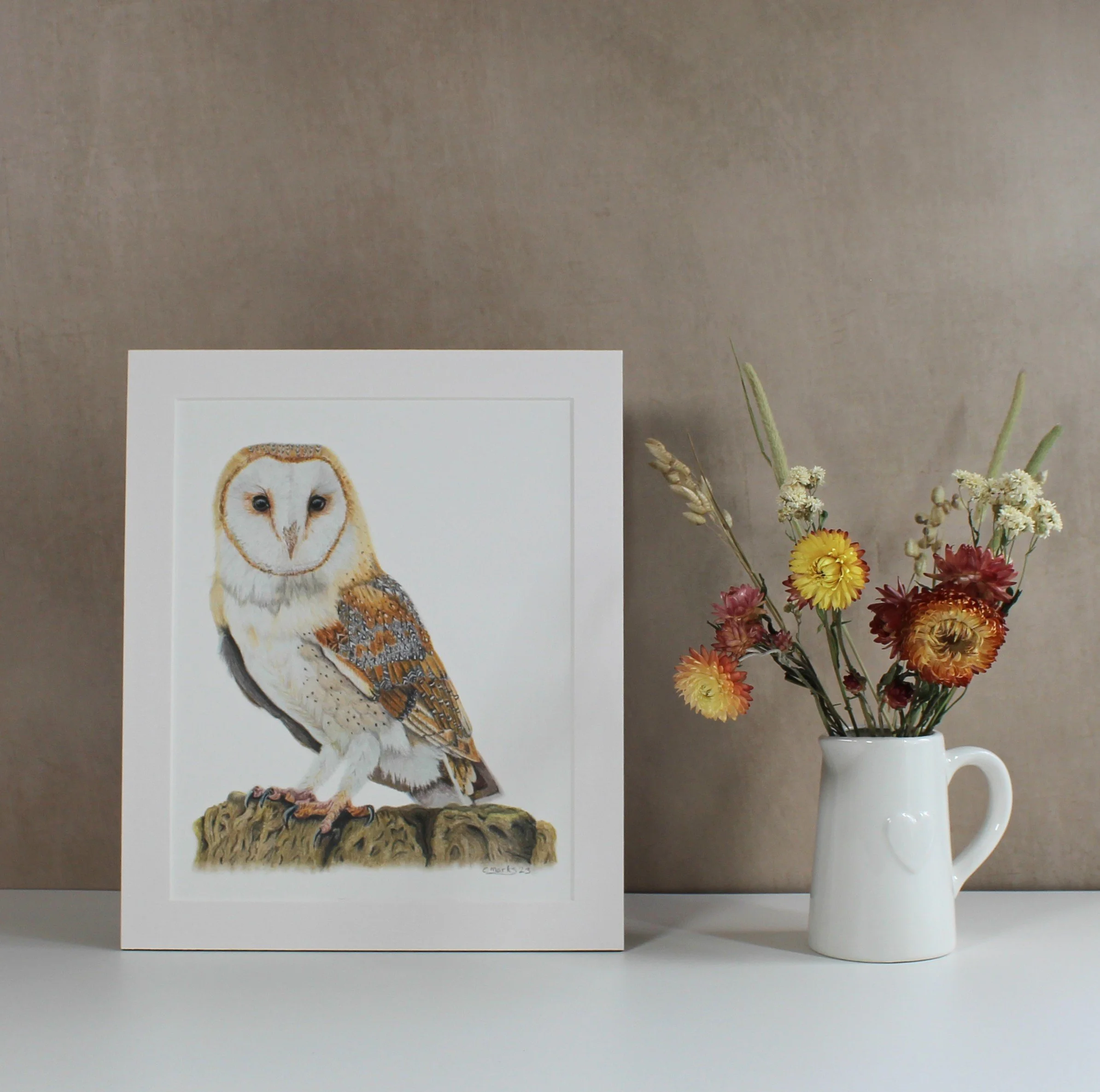 A mounted fine art print featuring a barn owl drawing.