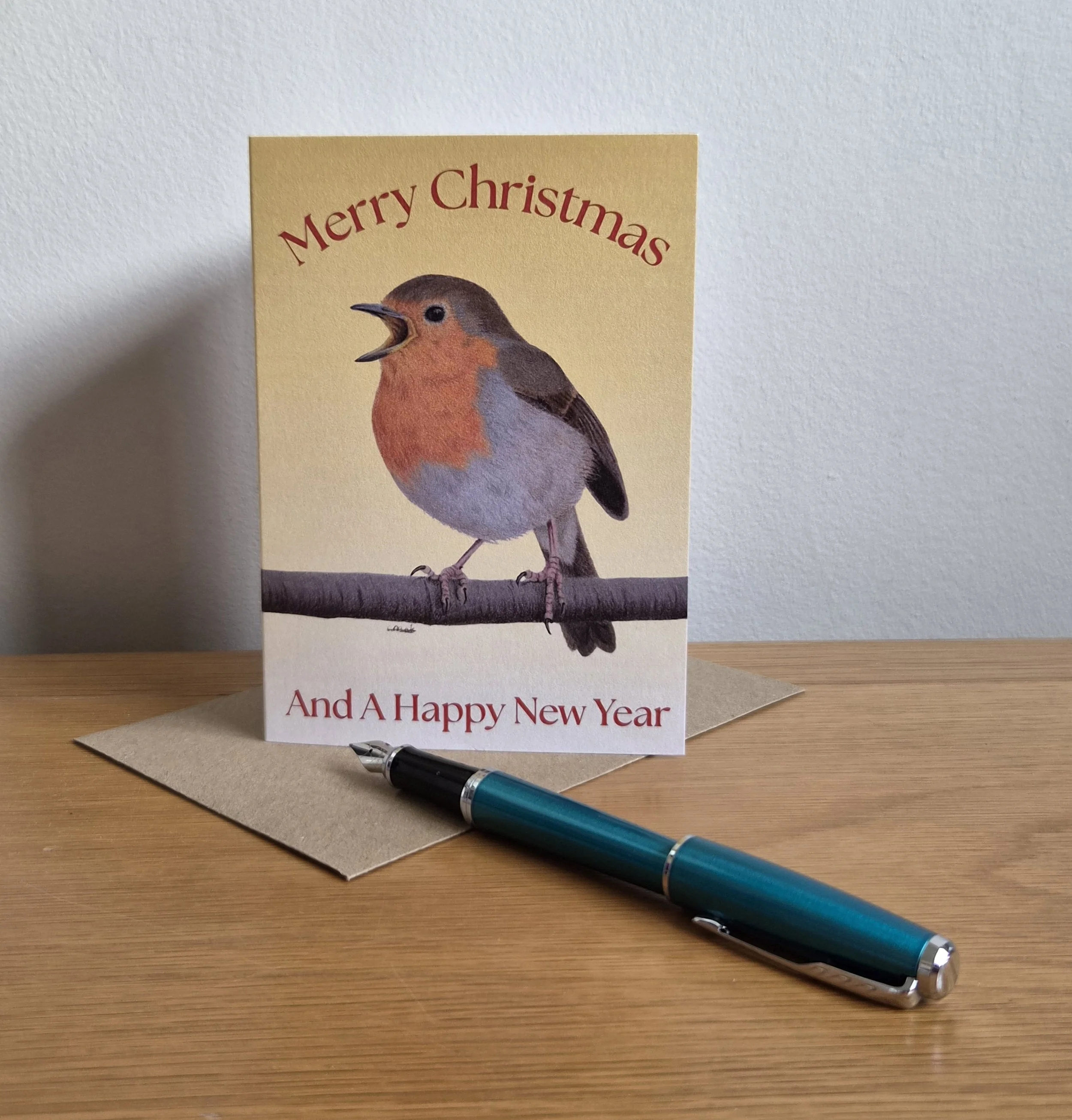 Robin singing Christmas card with envelope (blank inside).