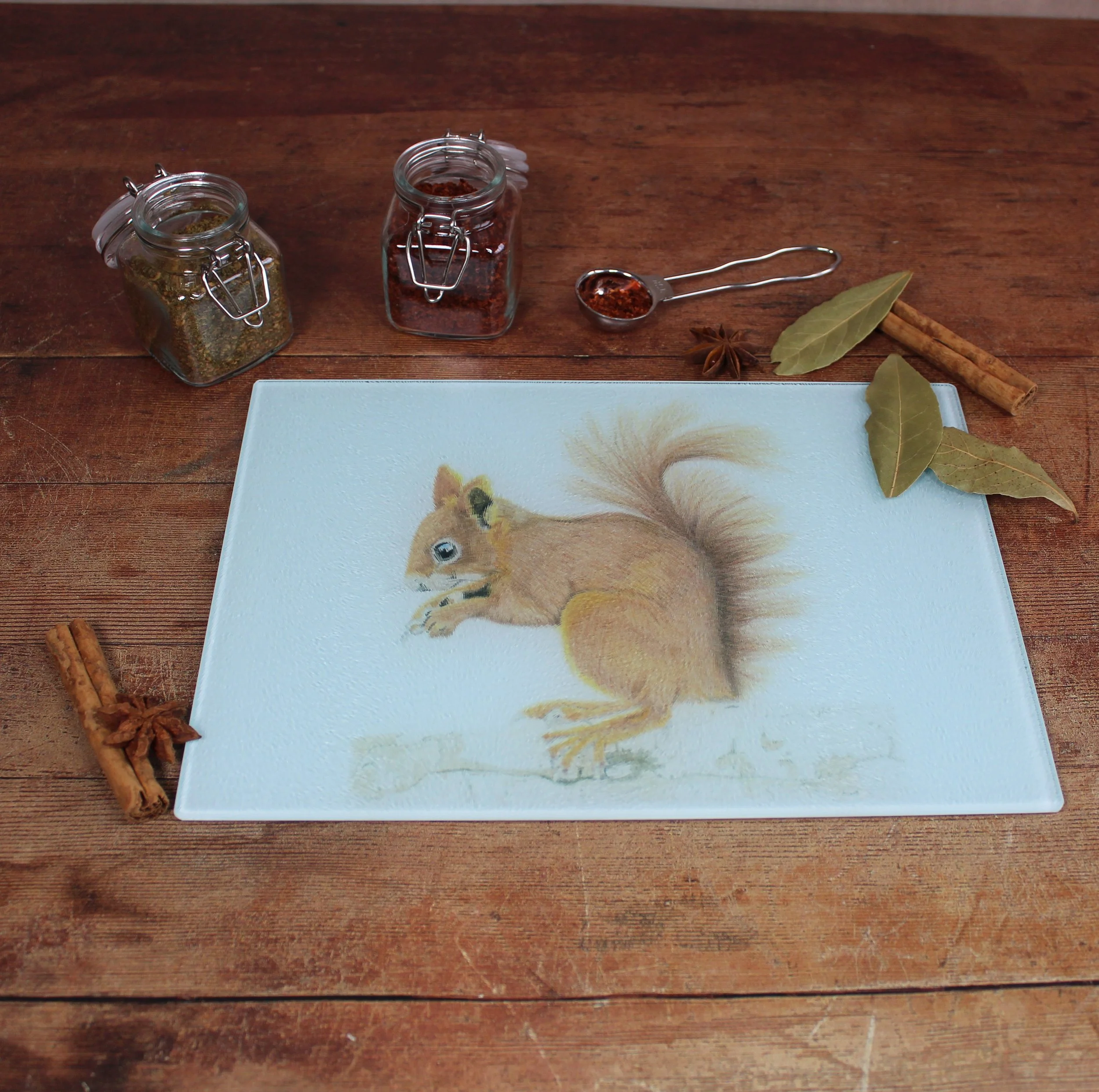 Red squirrel small glass chopping board / worktop saver.
