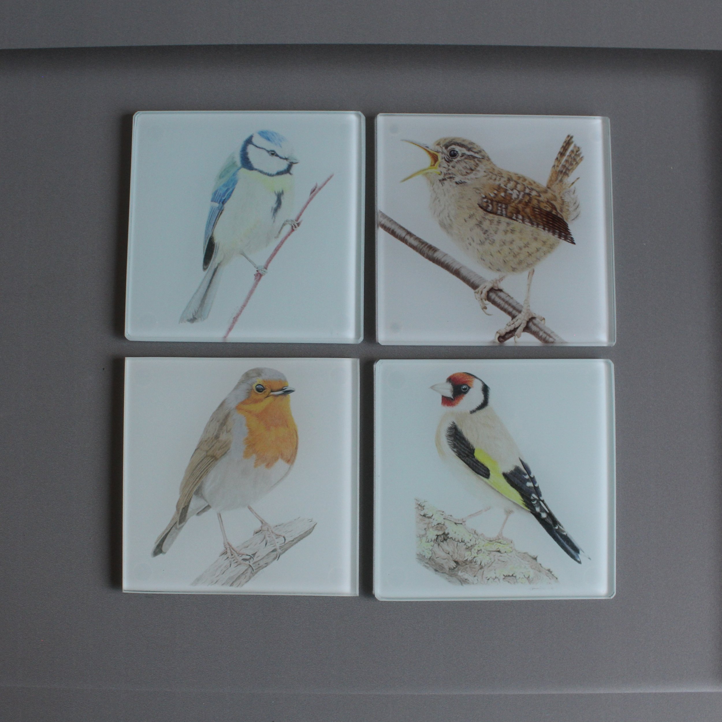 Goldfinch, wren, robin and blue tit glass coasters.