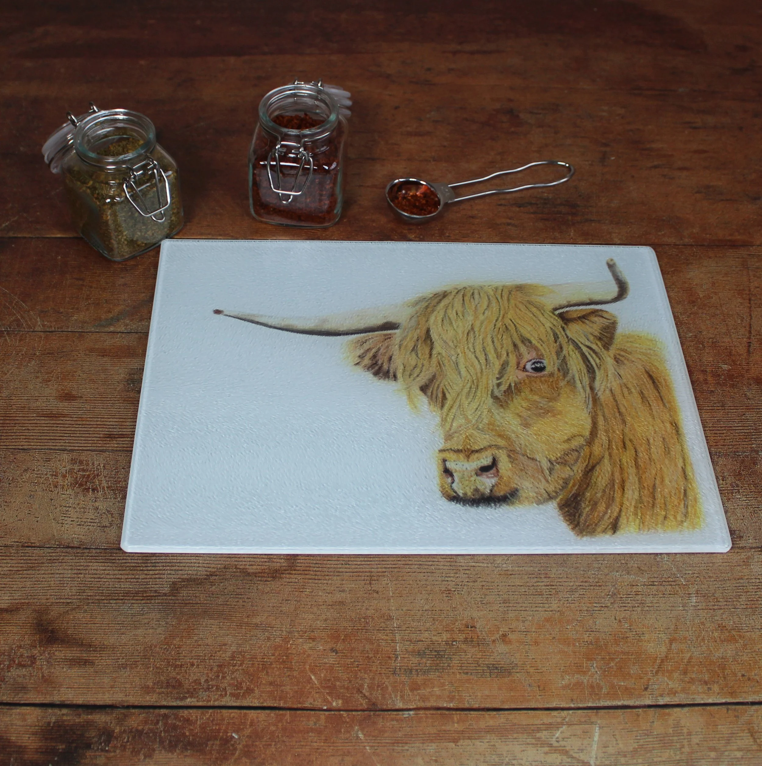 Highland cow small glass chopping board / worktop saver.