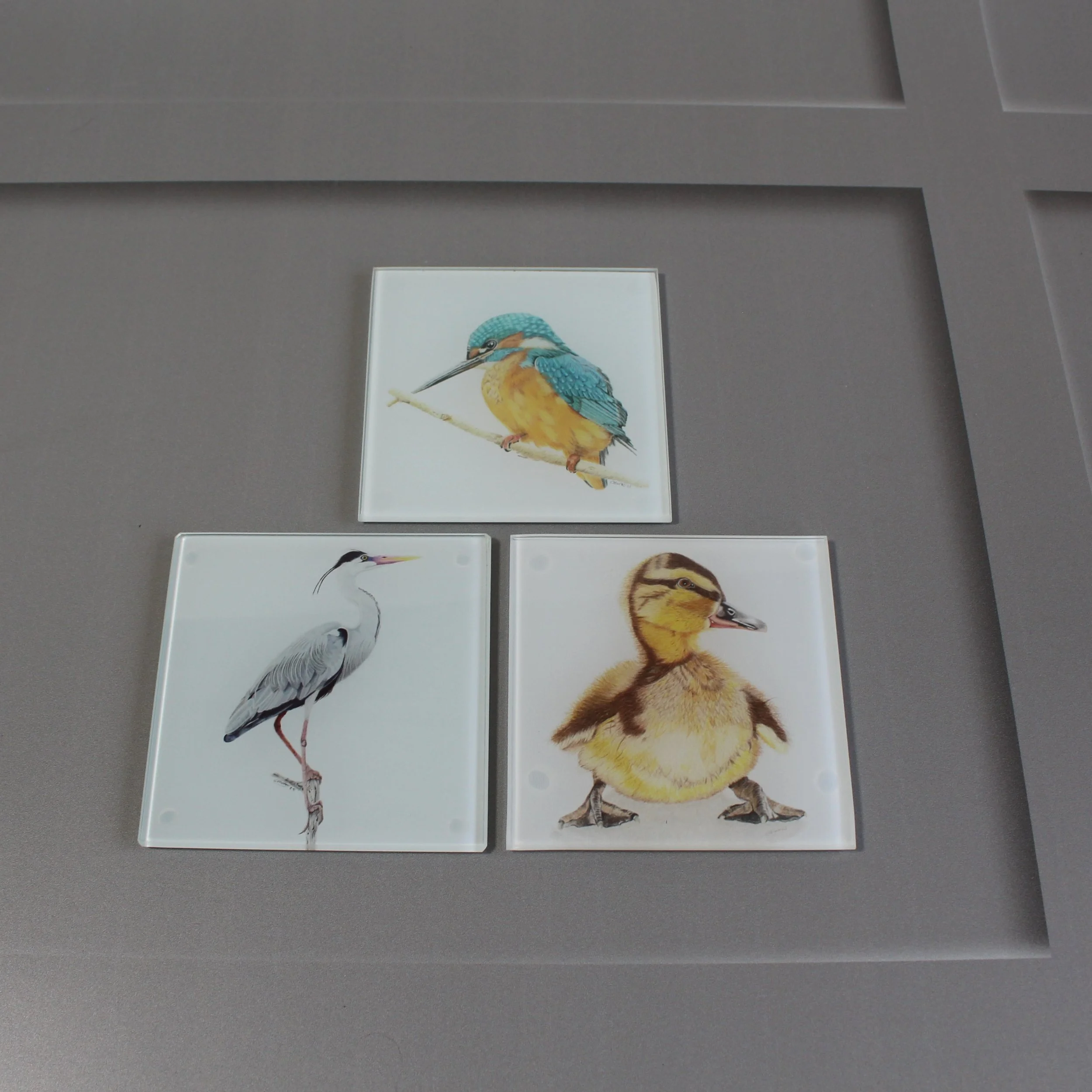 Duckling, kingfisher and heron glass coasters.