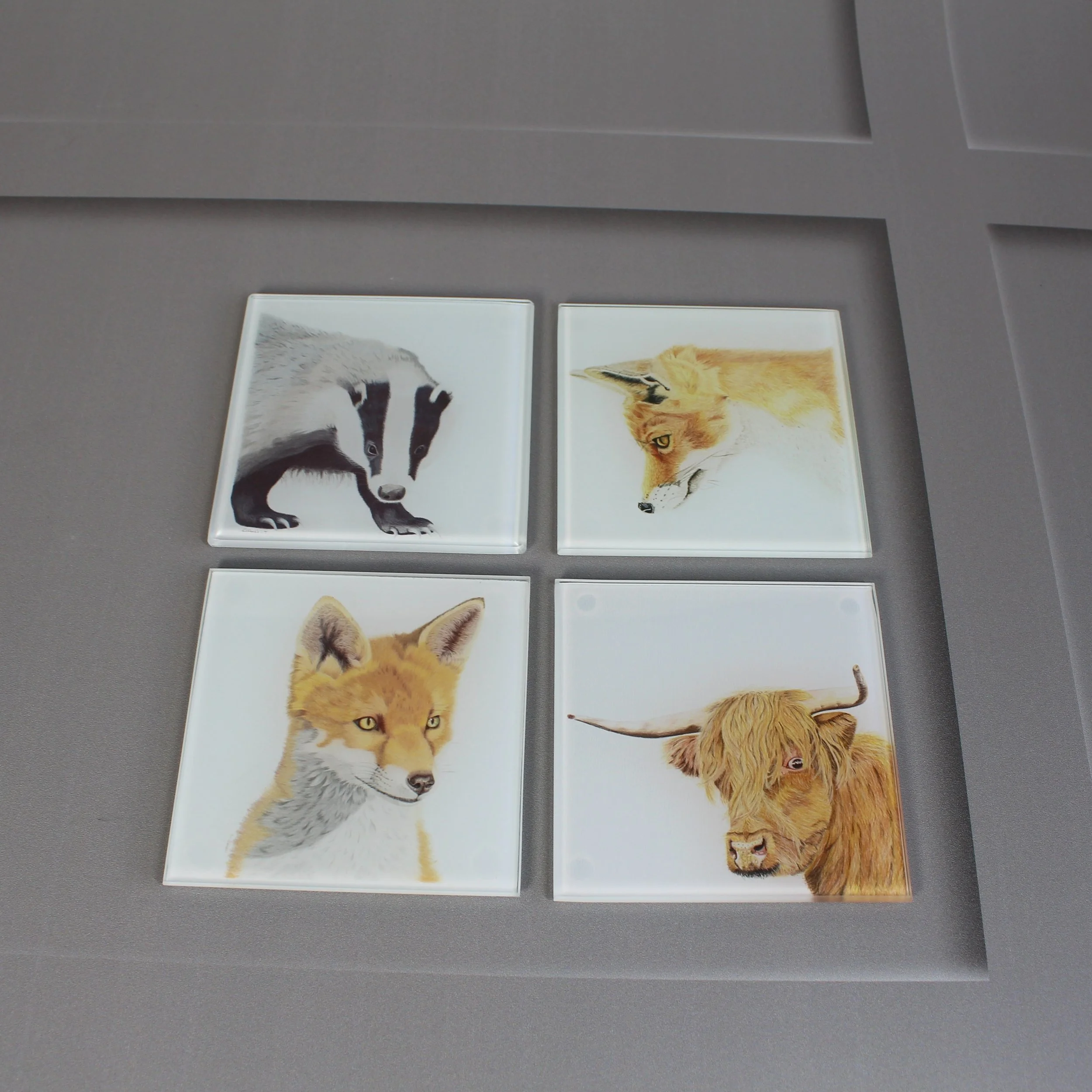 Fox, badger and highland cow glass coasters.