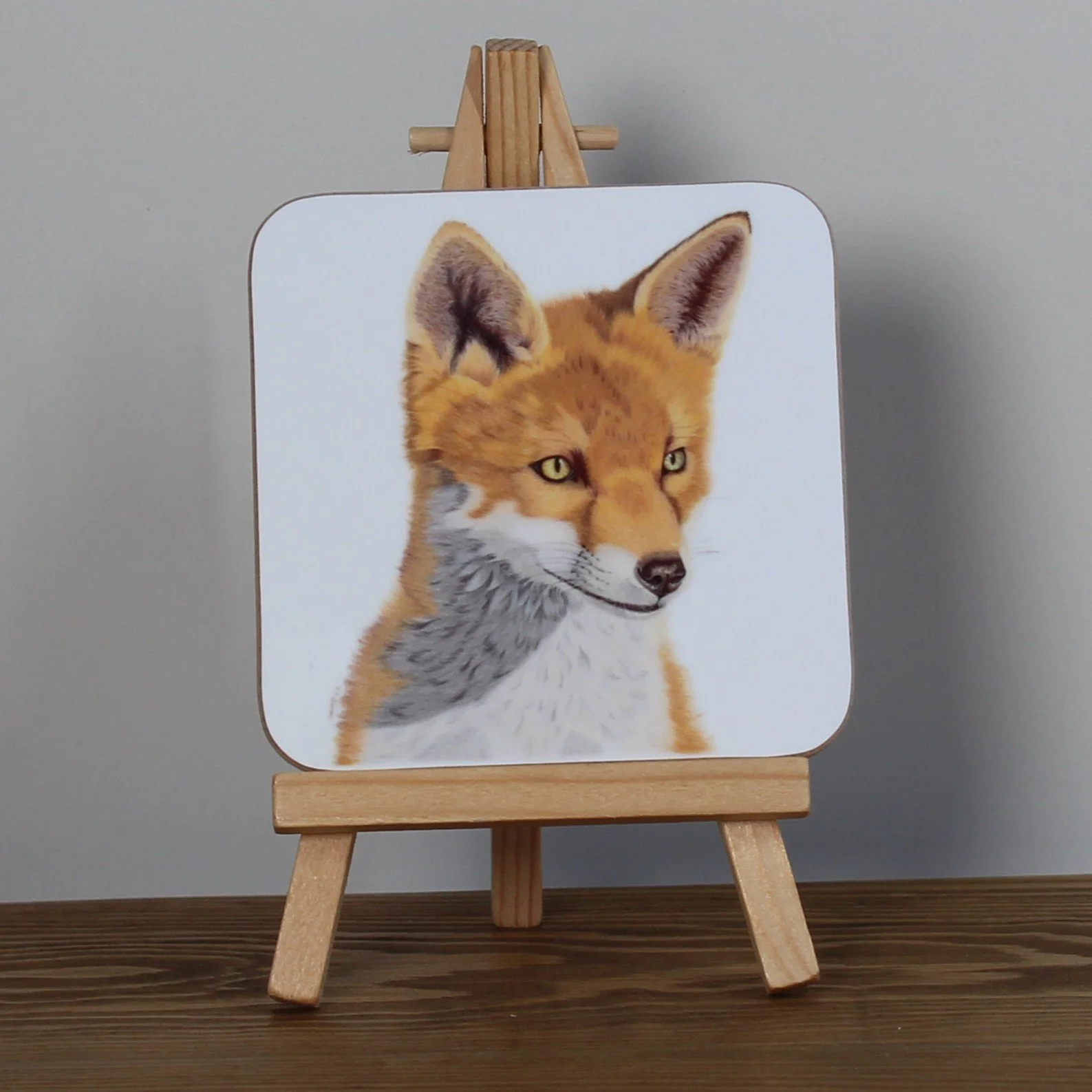 Individual glossy gazing fox coaster.