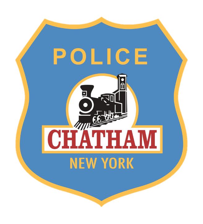 Badge with blue background, yellow border, featuring a black and white train engine, the word 'POLICE' at the top, 'CHATHAM' in large red letters below the train, and 'NEW YORK' at the bottom.