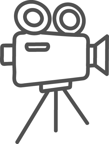 Icon of a vintage movie camera on tripod with two reels on top