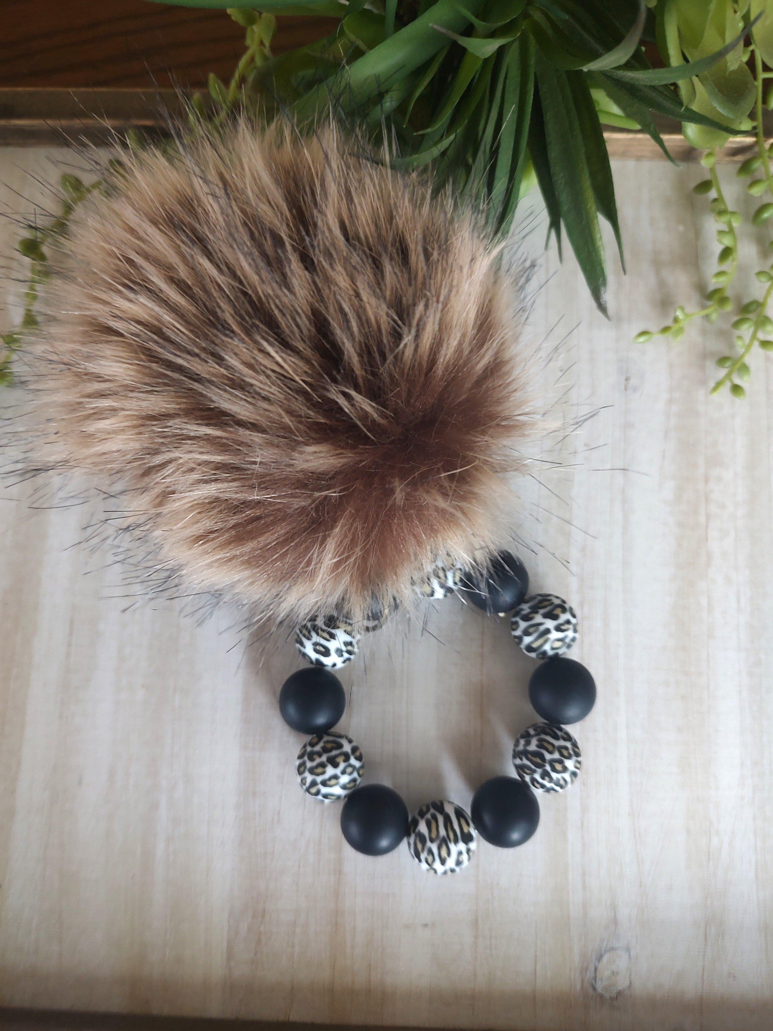 Pom-Pom-Wristlet-Brown.jpg