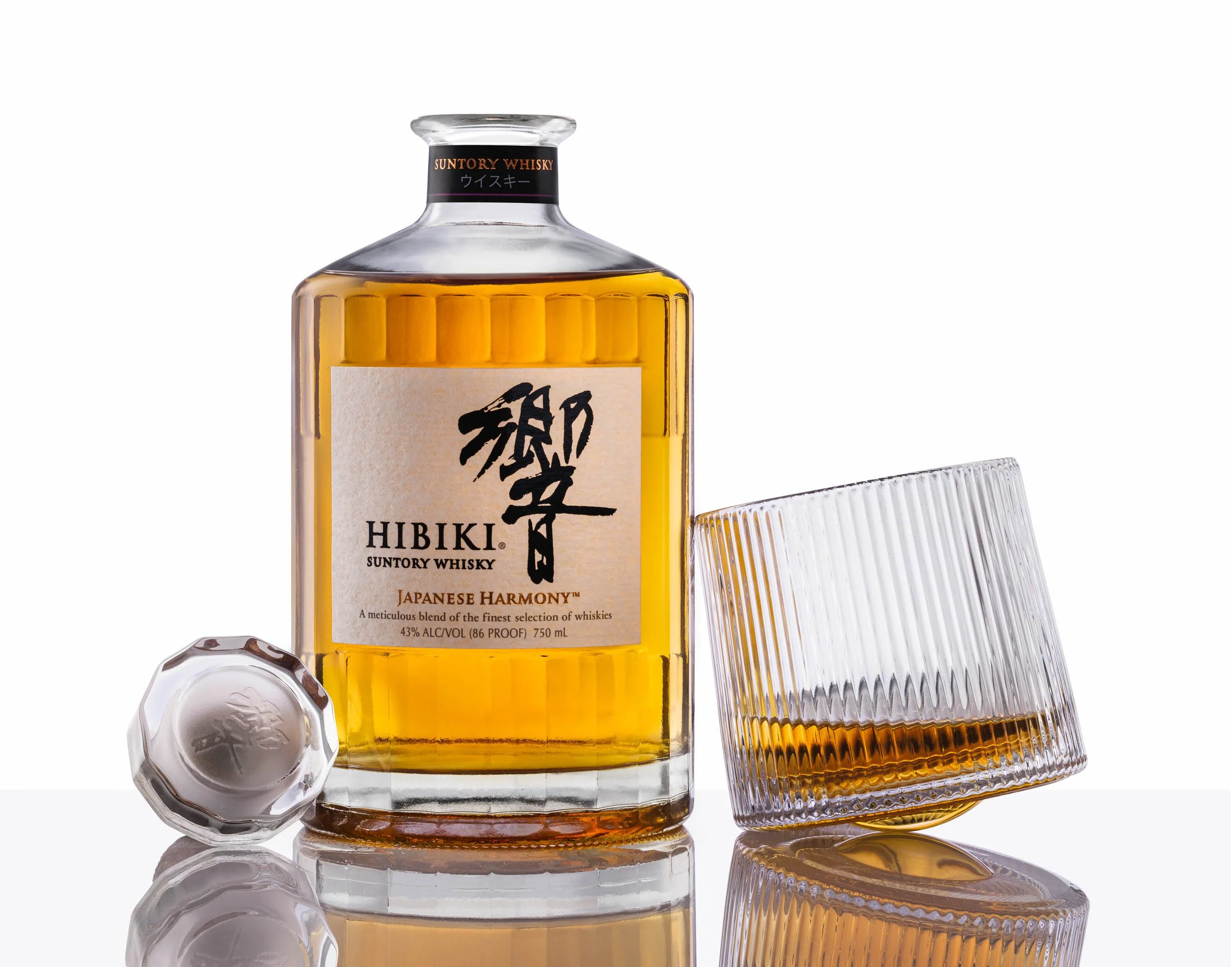 Hibiki Suntory Japanese whisky e-commerce photography, minimalist spirits product shot on white, clean commercial beverage branding, professional Suntory bottle catalog imagery, high-key Japanese whiskey advertising photography.