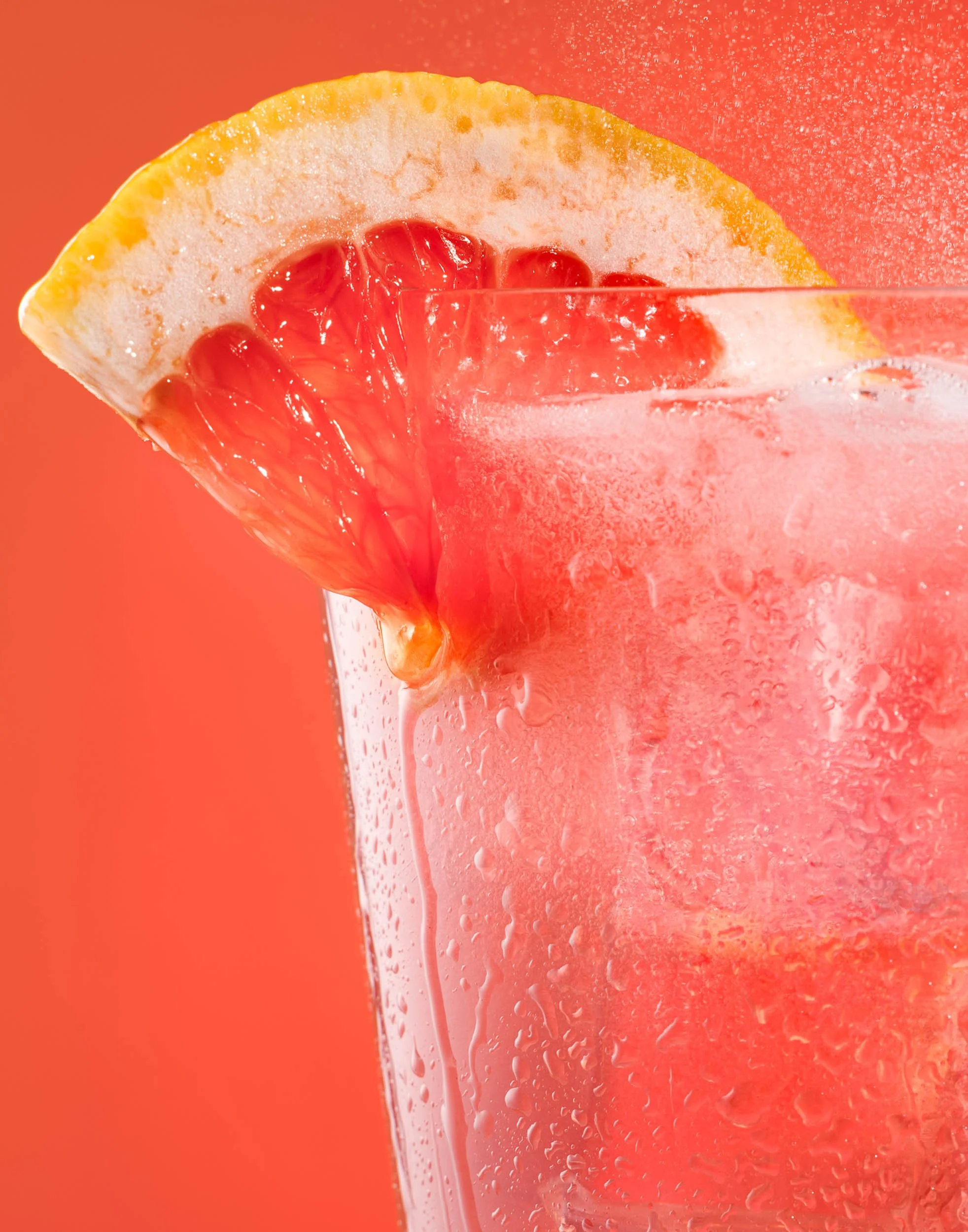 Macro beverage photography, grapefruit soda carbonation detail, refreshing fizzy drink texture shot, commercial liquid styling, professional sparkling water branding, close-up citrus cocktail advertising imagery.