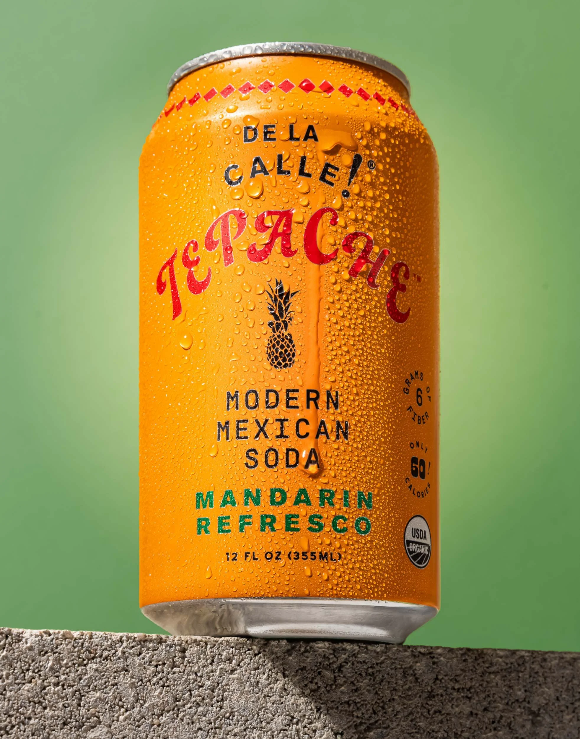 De La Calle Tepache beverage photography, professional canned soda product branding, orange Mandarin Refresco can with condensation drops, vibrant commercial drink photography, modern Mexican soda advertising imagery.