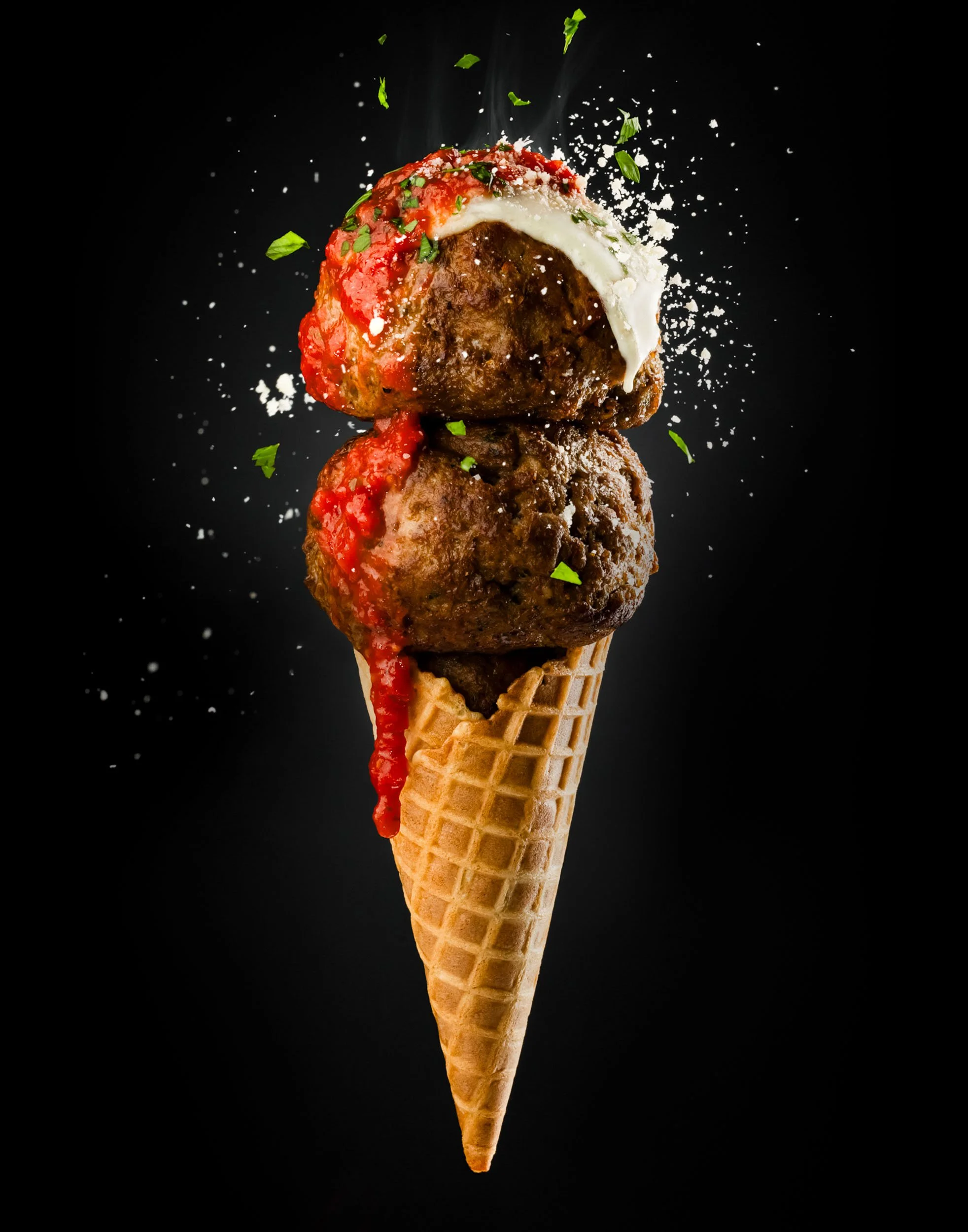 Creative food styling photography, gourmet meatball cone appetizer, innovative culinary branding, editorial food photography, professional restaurant menu design imagery, unique handheld food concept shot.