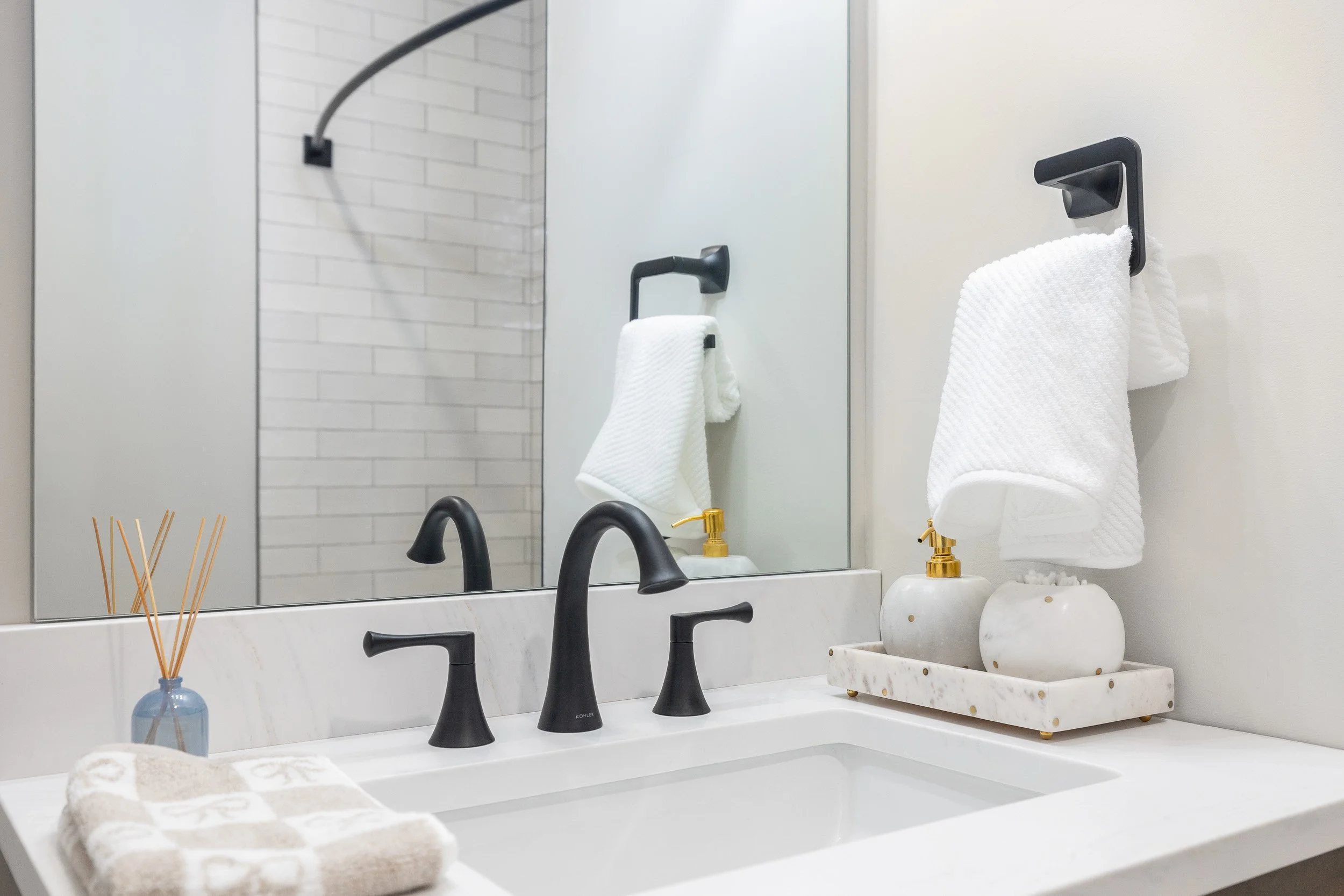Luxury bathroom interior photography, professional detail shot of modern matte black fixtures, high-end hospitality bathroom design with marble vanity, architectural photography of interior finishes and hardware, minimalist bathroom styling for bouti