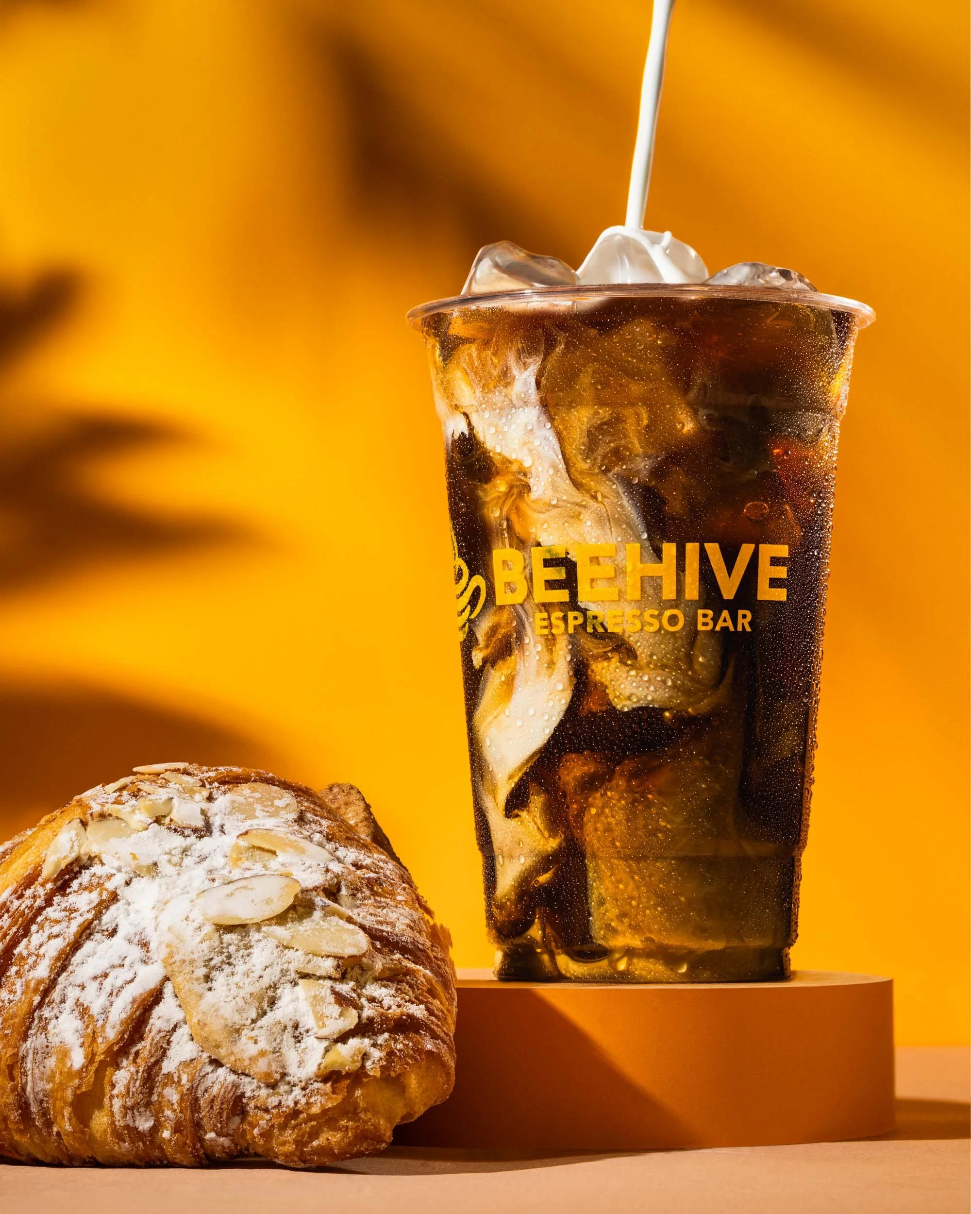 New York food and beverage photography for Beehive Espresso Bar featuring iced coffee, pastry, and hospitality brand marketing imagery.