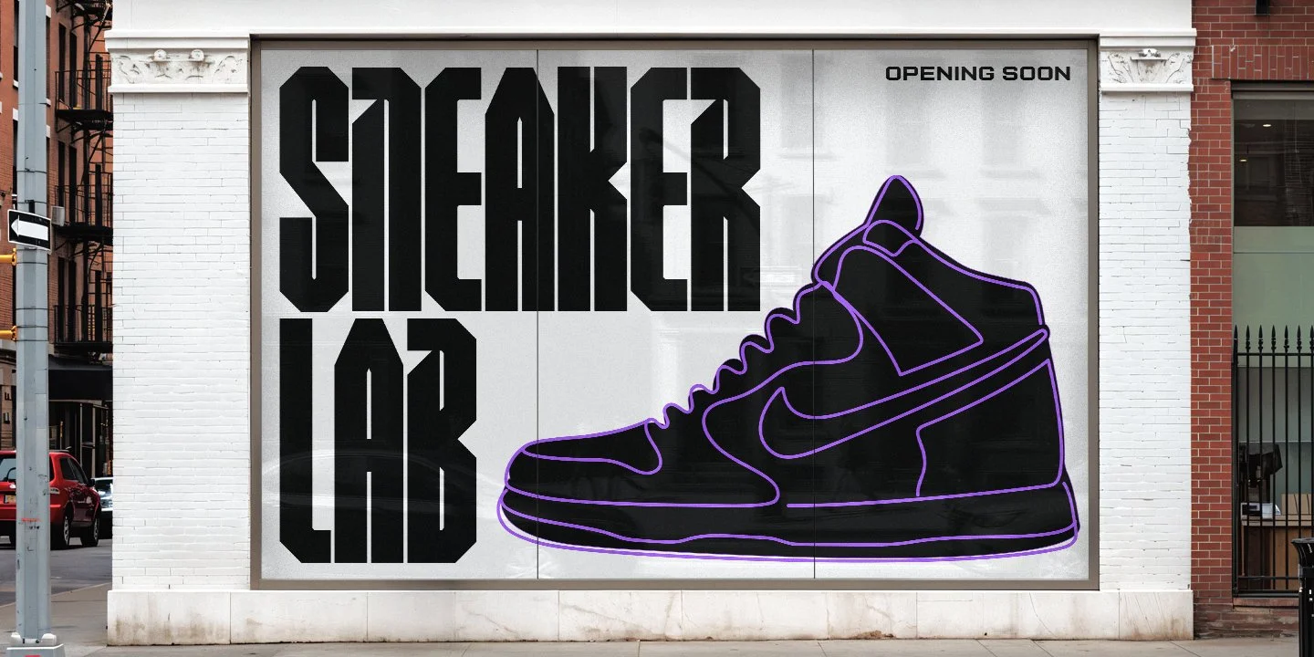 A large poster featuring the words 'SNEAKER LAB' in bold black letters, a purple outline of a Nike sneaker, and a small 'OPENING SOON' message.