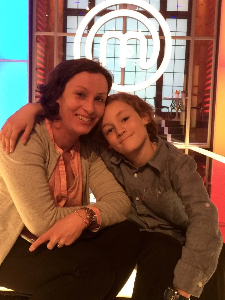 Executive producer on set in Toronto with her son.jpeg