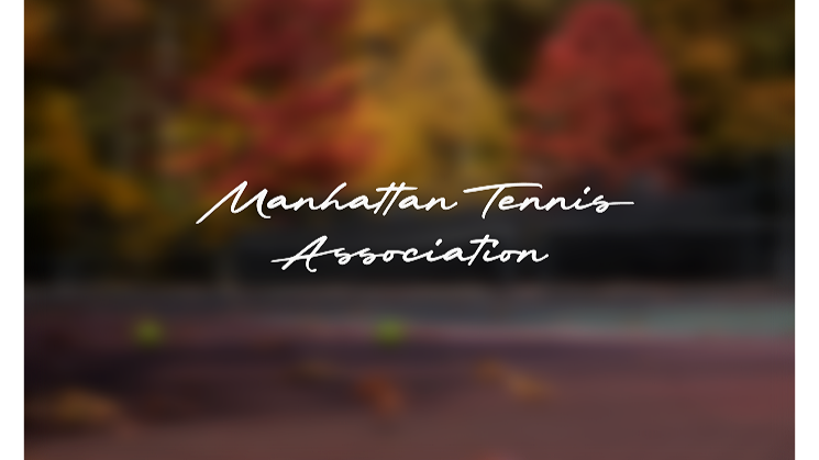 Indoor tennis court with a green curtain wall, net in the middle, and reflective polished floor showing the curtain and ceiling.