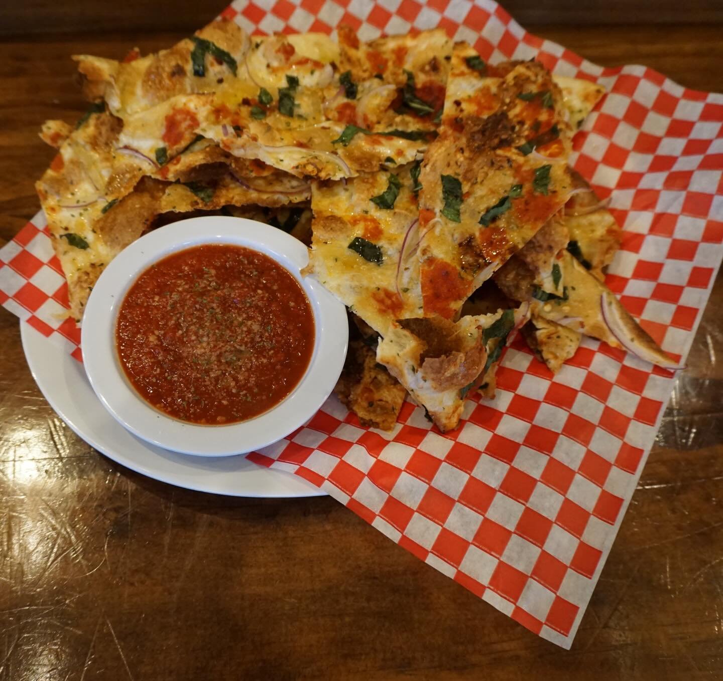Flatbread! On the menu since &lsquo;06. If you know you know and if you don&rsquo;t you oughta. Try it in the OG style, or take it up a notch and add basil, shredded parm, or a kick of Calabrian chili oil for some heat on a cold day. Best served and 