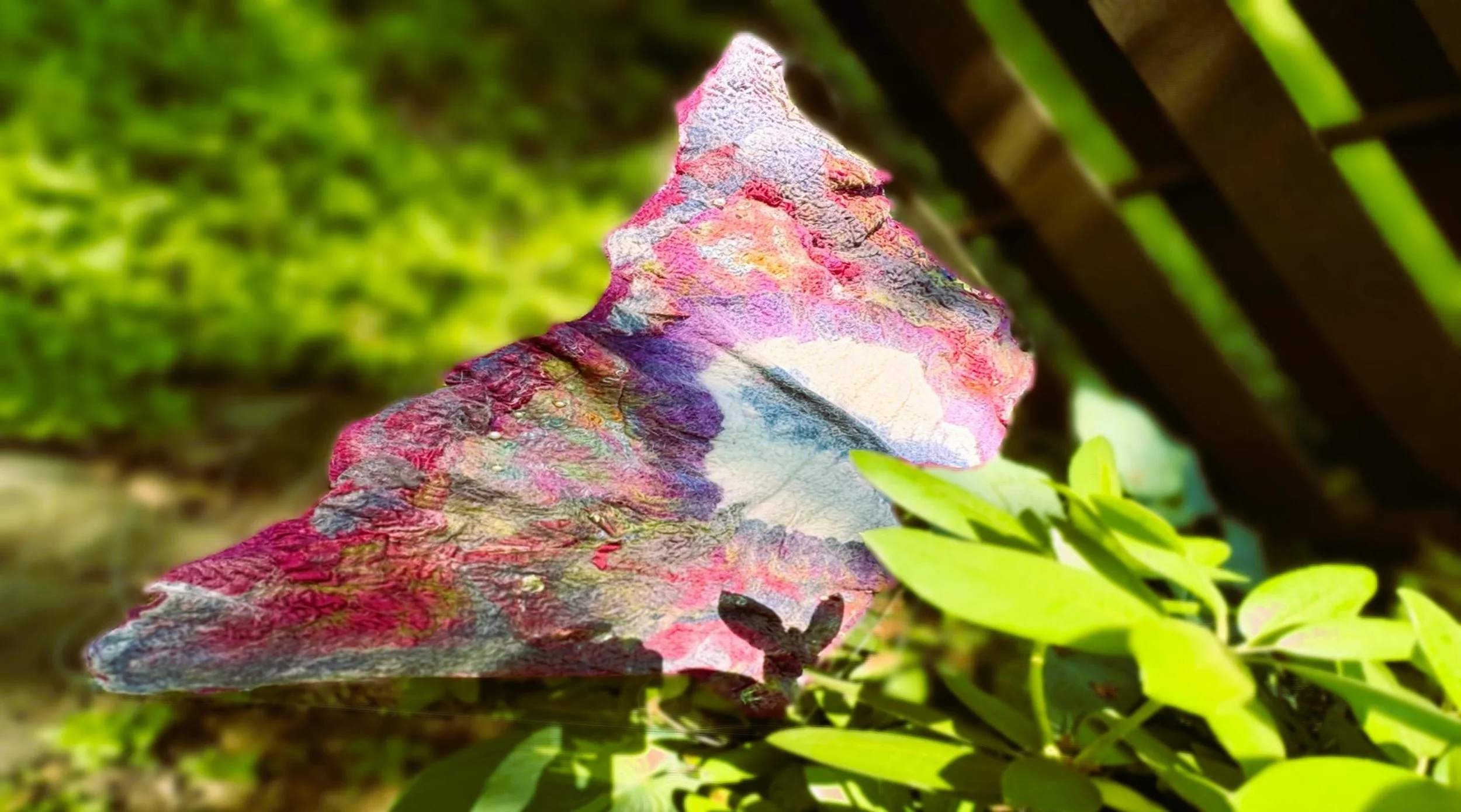 picture of a sculpted butterfly in a garden