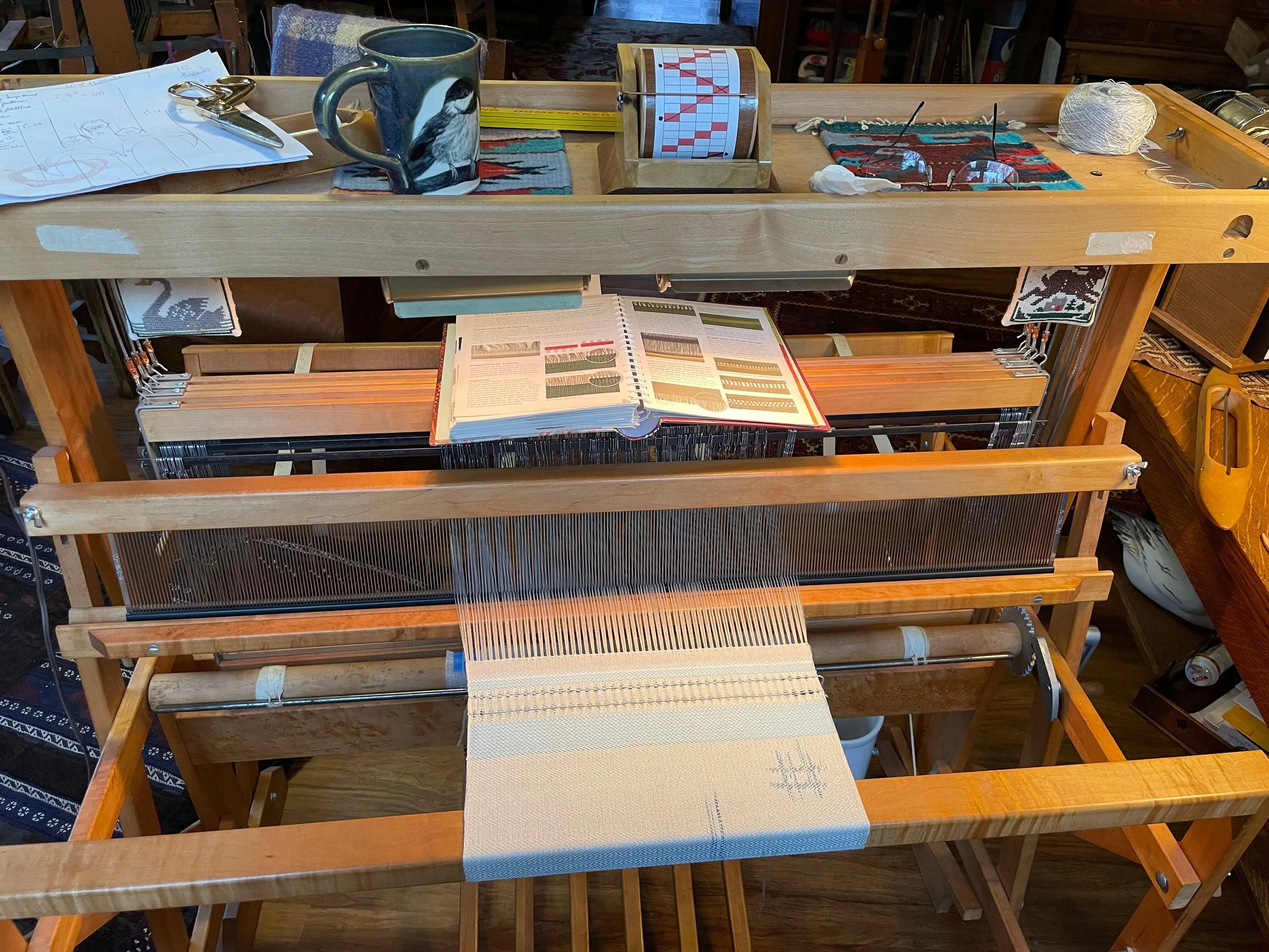 loom with woven warp and Weaver's Perfect Memory draft tracking tool