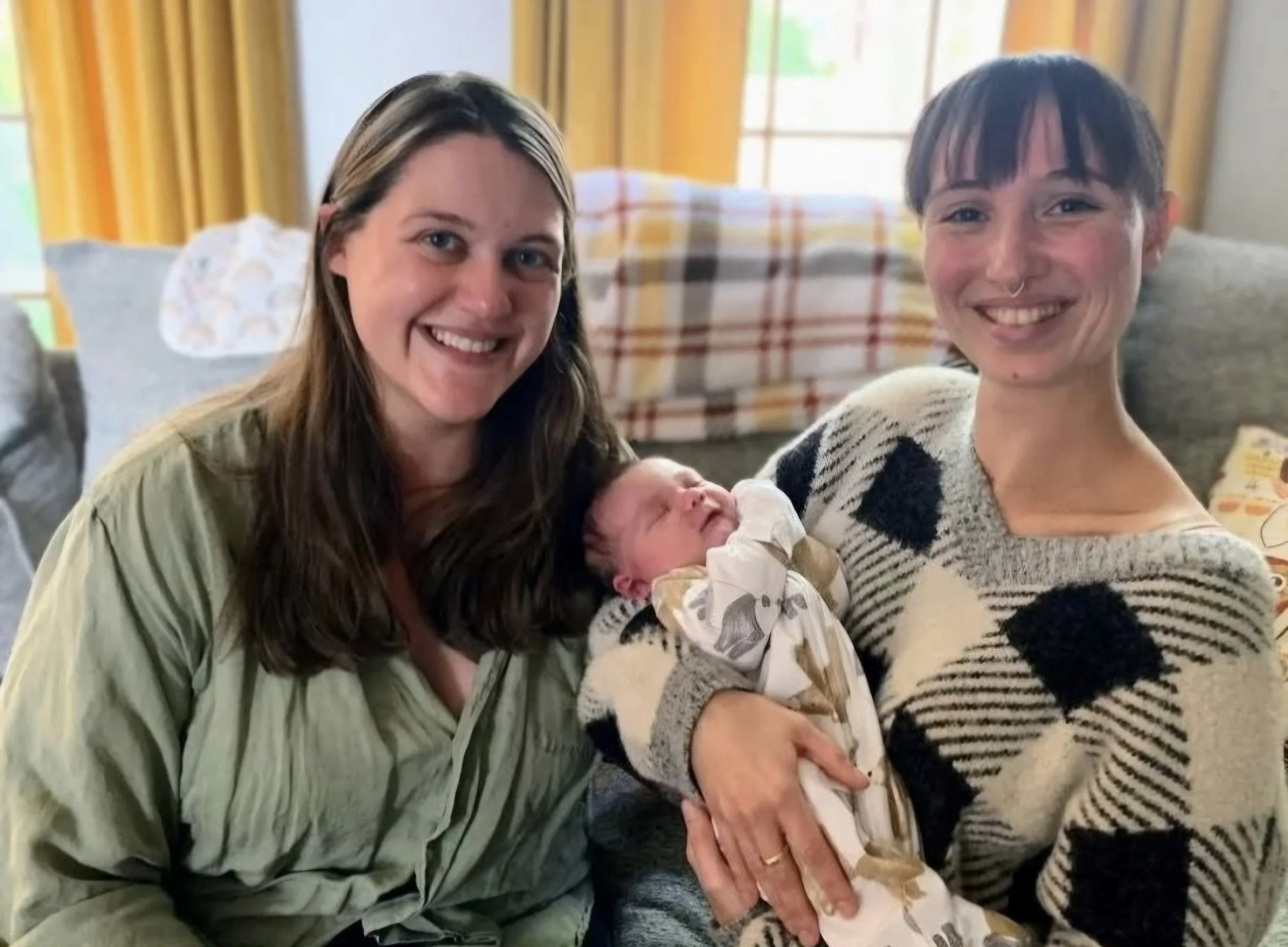 Postpartum mom and baby with doula